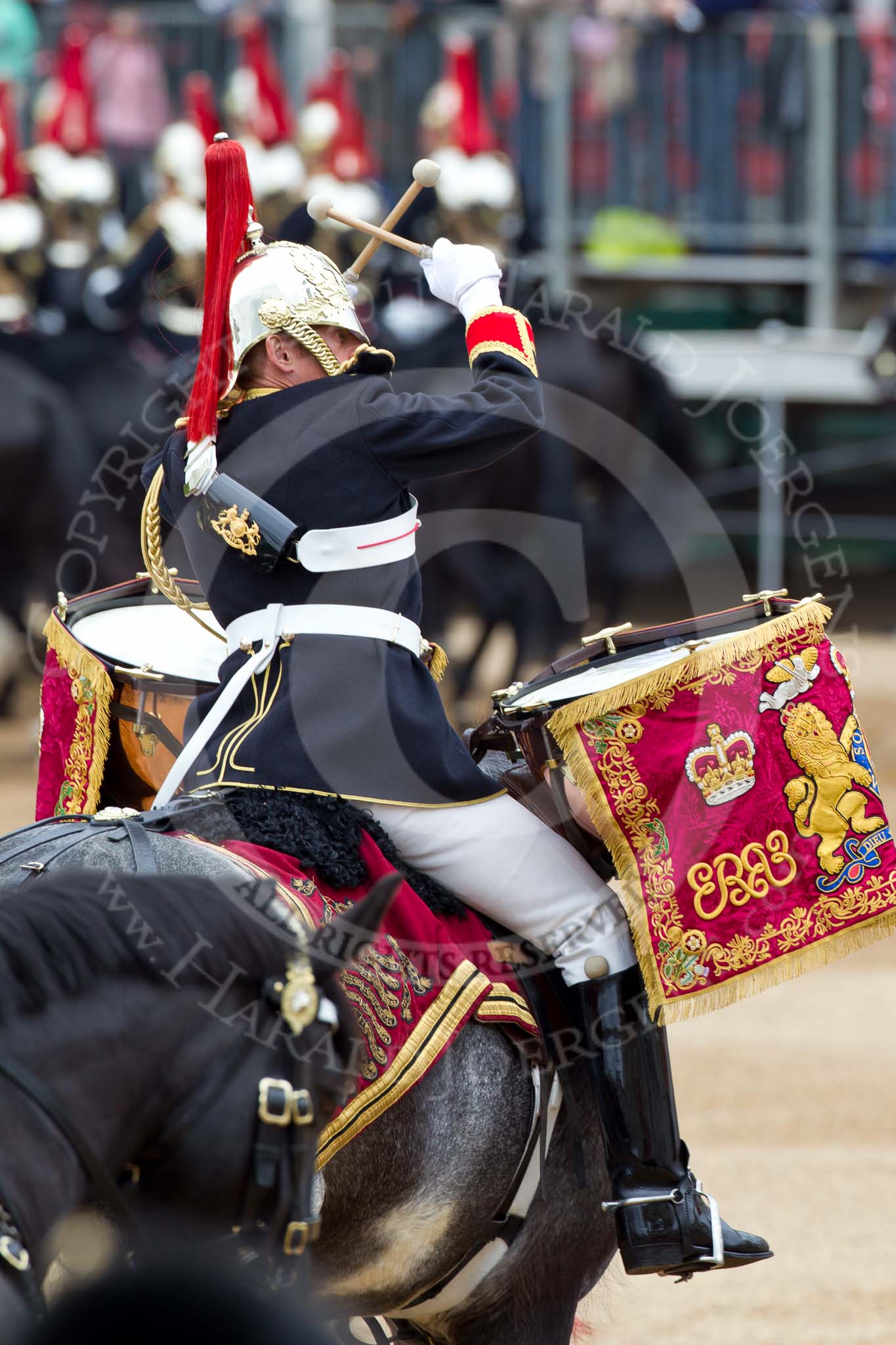 The Major General's Review 2011: The kettle drummer from The Band of the Blues and Royals, saluting by crossing his drum sticks..
Horse Guards Parade, Westminster,
London SW1,
Greater London,
United Kingdom,
on 28 May 2011 at 11:59, image #262