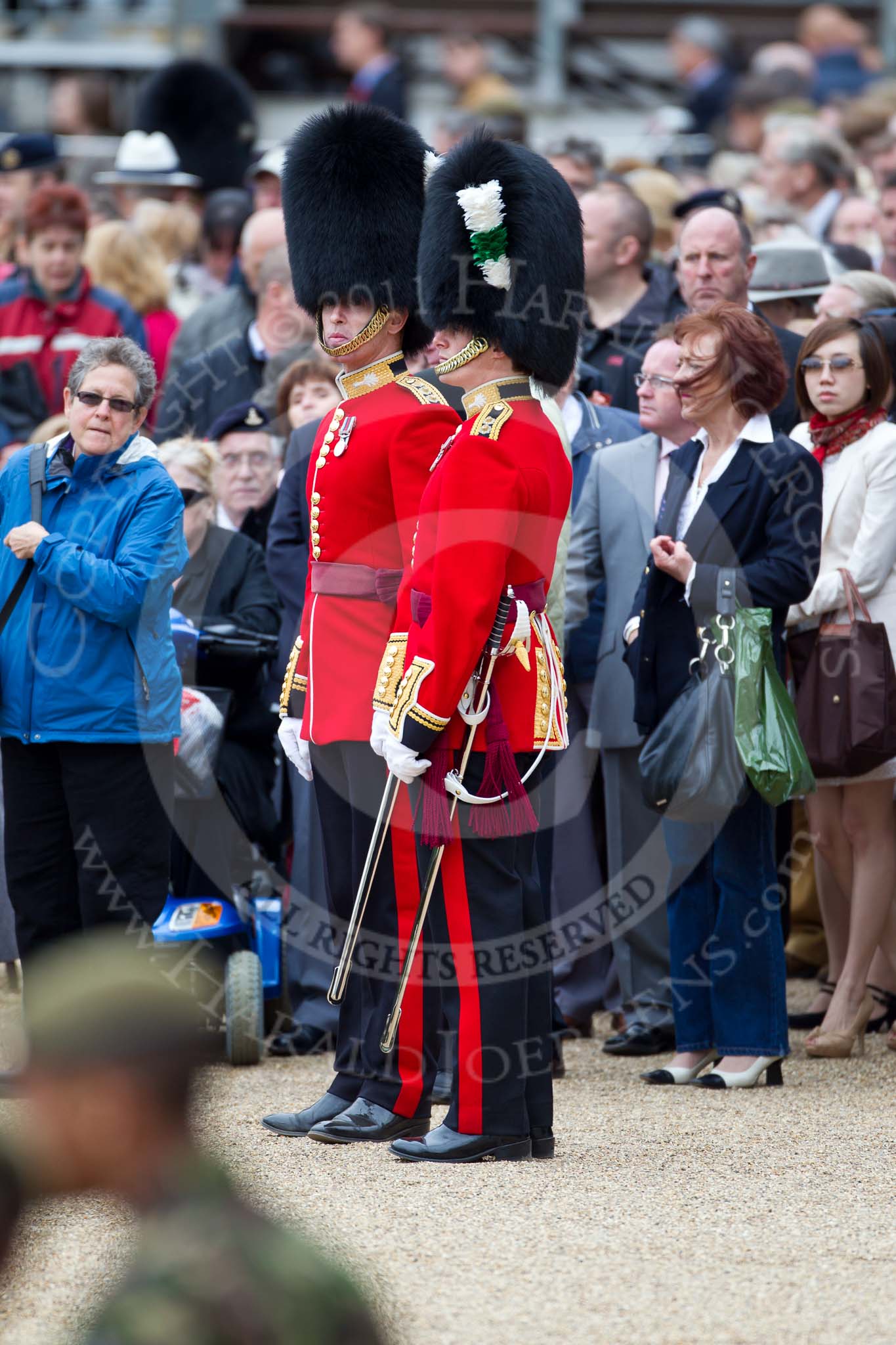 The Major General's Review 2011: After the rehearsal. Spectators getting ready to leave behind two officers from the Welsh Guards..
Horse Guards Parade, Westminster,
London SW1,
Greater London,
United Kingdom,
on 28 May 2011 at 12:15, image #295