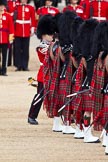 The Major General's Review 2011: The Lone Drummer, Lance Corporal Gordon Prescott, has left the line, marching to a position at the right of the Escort to the Colour, where he will bear the 'drummers call', which will start the next phase of the parade. Here he is passing the Pipers of the Band of the Scots Guards..
Horse Guards Parade, Westminster,
London SW1,
Greater London,
United Kingdom,
on 28 May 2011 at 11:15, image #151