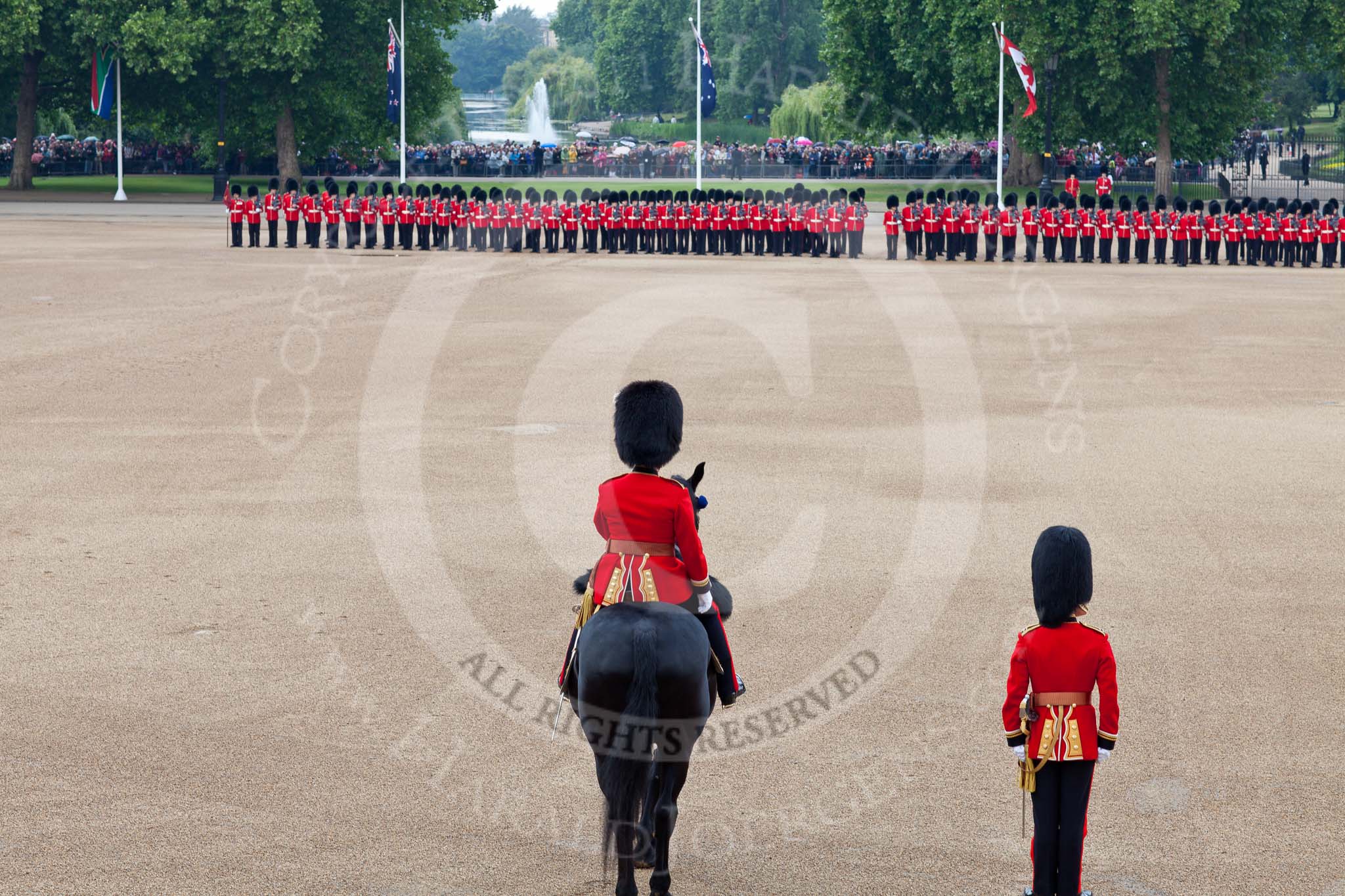 Trooping the Colour 2011: Horse Guards Parade with St. James's Park in the background. 
From the left - No.1 Guard (Escort for the Colour), 1st Battalion Scots Guards,  followed by No. 2 Guard (B Company Scots Guards).
In the foreground the Major of the Parade, Major B P N Ramsay, Welsh Guards..
Horse Guards Parade, Westminster,
London SW1,
Greater London,
United Kingdom,
on 11 June 2011 at 10:37, image #62