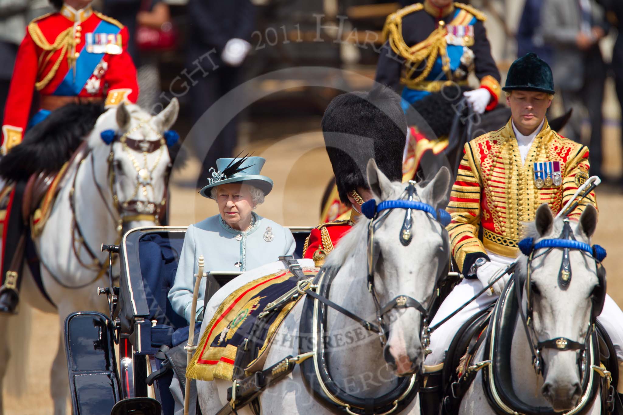 Trooping the Colour 2011: Her Majesty The Queen with Prince Philip on the ivory mounted phaeton, arriving on Horse Guards Parade. In the foreground head coachman Jack Hargreaves, in the background The Princess Royal and The Duke of Kent as two of the Royal Colonels..
Horse Guards Parade, Westminster,
London SW1,
Greater London,
United Kingdom,
on 11 June 2011 at 10:59, image #126