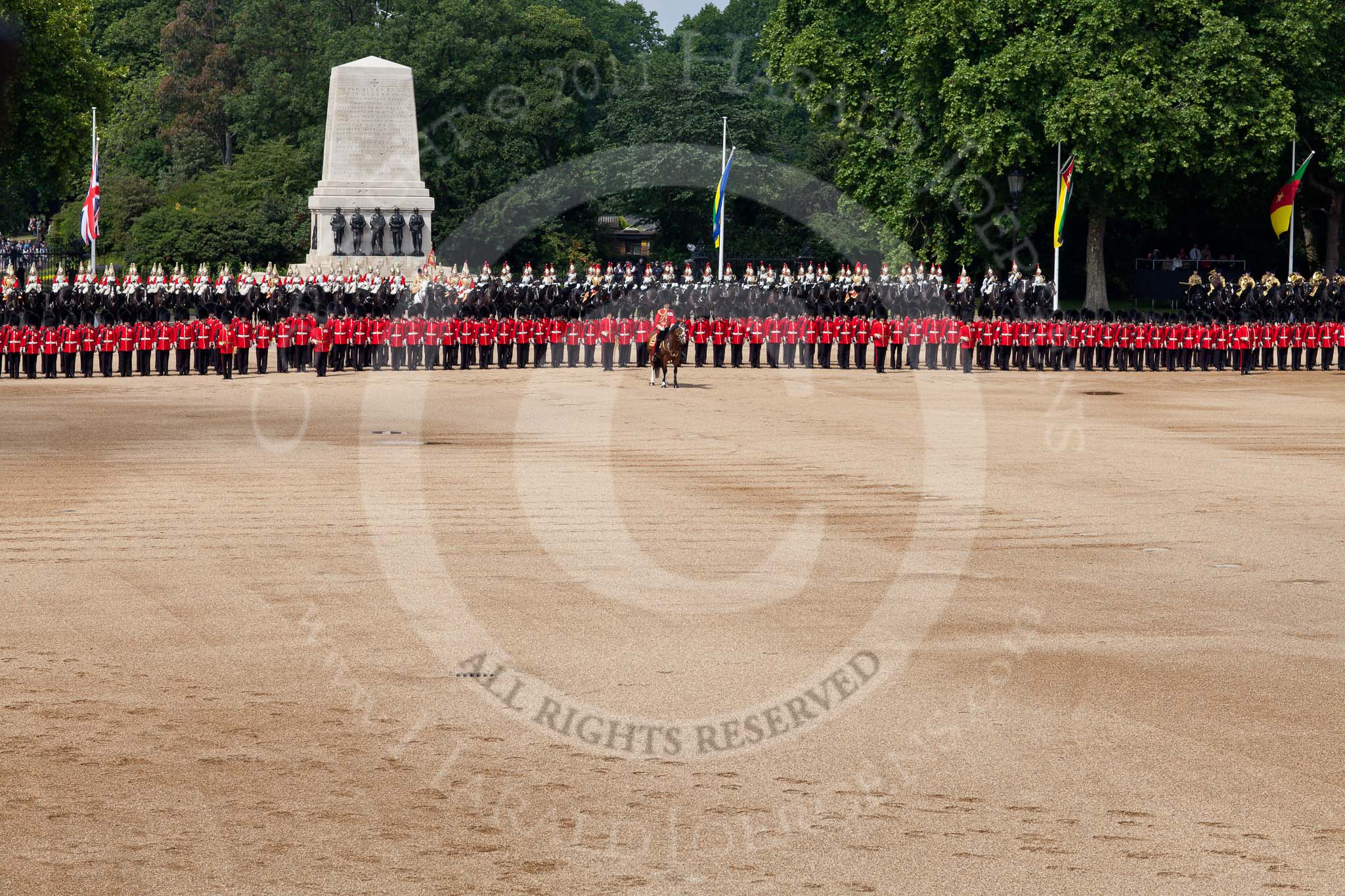 Trooping the Colour 2011: The line of guards (from the left to the right No. 1 to No. 5 Guard), behind them the Life Guards and Blues and Royals, behind them the Guards Memorial and St. James's Park. In front of them the Field Officer, Lieutenant Colonel Lincoln P M Jopp..
Horse Guards Parade, Westminster,
London SW1,
Greater London,
United Kingdom,
on 11 June 2011 at 11:11, image #181