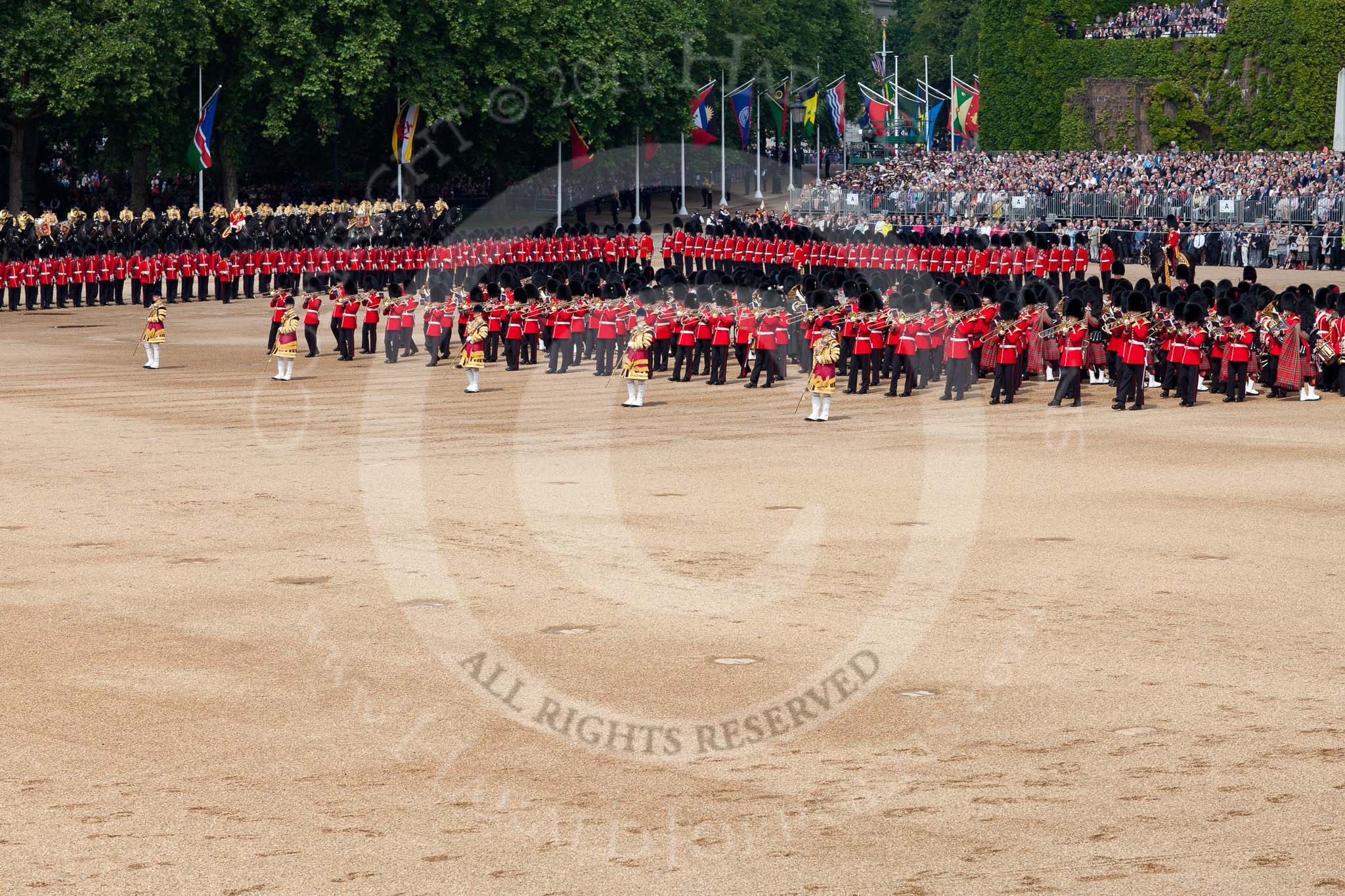 Trooping the Colour 2011: The Massed Bands, in the process of changing direction, lead by their Drum Majors..
Horse Guards Parade, Westminster,
London SW1,
Greater London,
United Kingdom,
on 11 June 2011 at 11:11, image #182
