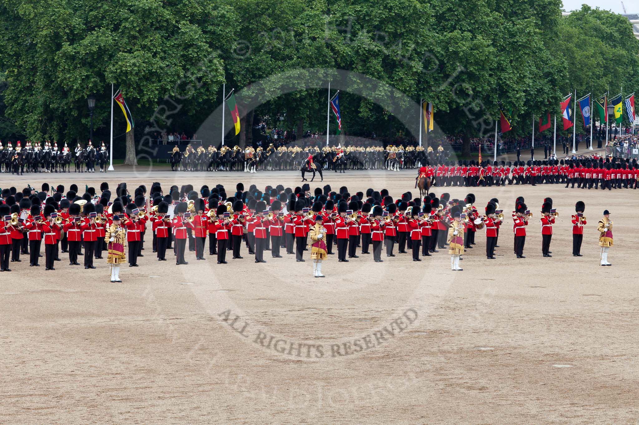 Trooping the Colour 2011: The March Past. On the left, the Massed Bands playing, marching, on the right of the photo, the guards divisions. On Top, No. 1 Guards, the Escort to the Colour, carrying the Colour.
On the backgound the Mounted Bands of the Household Divison, and on the left The Blues and Royals of the Household Cavalry..
Horse Guards Parade, Westminster,
London SW1,
Greater London,
United Kingdom,
on 11 June 2011 at 11:41, image #262