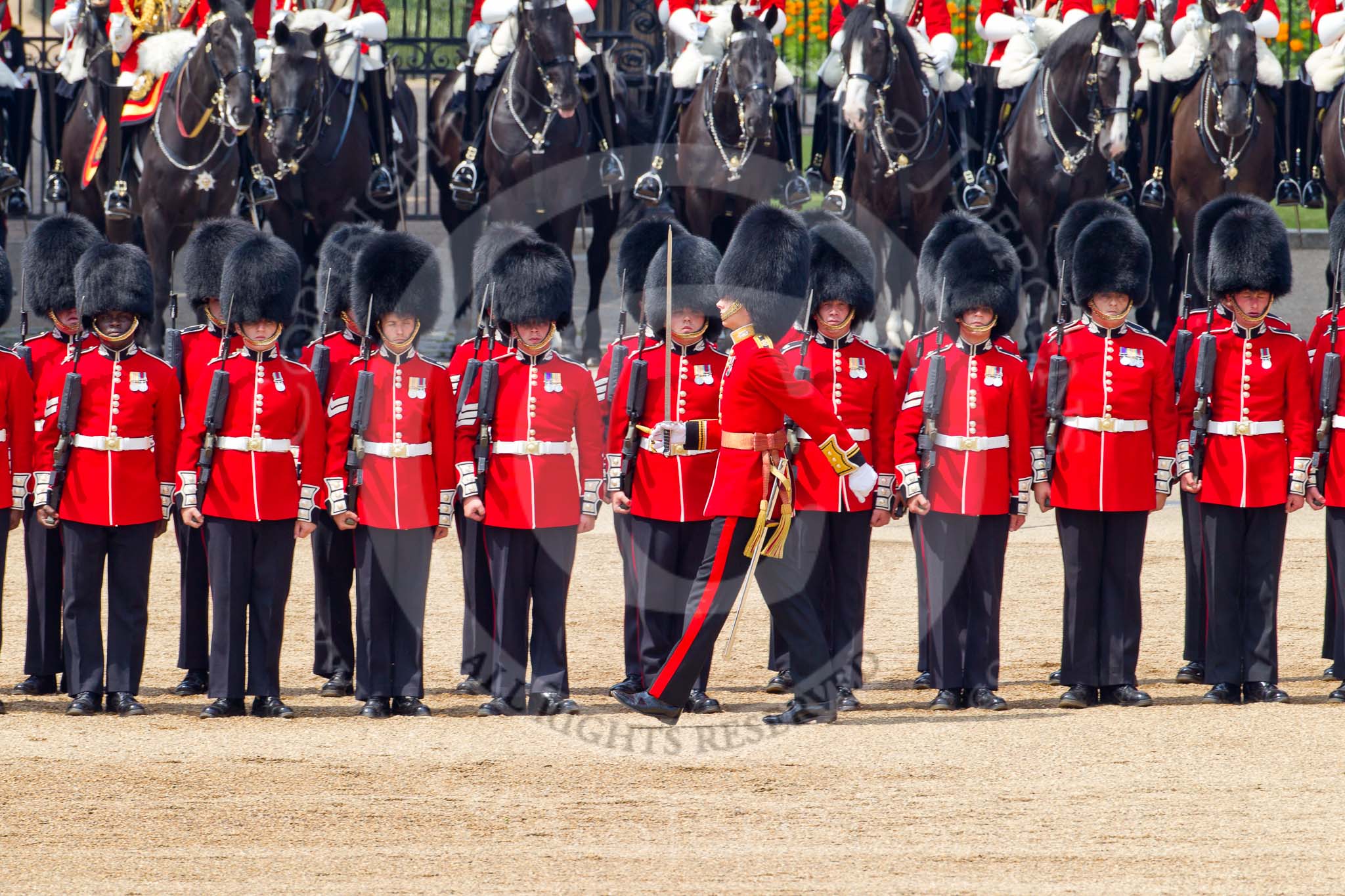 Trooping the Colour 2011: No. 2 Guard, B Company Scots Guards, during the March Past in slow time. In front, marching past the line of guardsmen, Lieutenant S E Kershaw..
Horse Guards Parade, Westminster,
London SW1,
Greater London,
United Kingdom,
on 11 June 2011 at 11:52, image #308