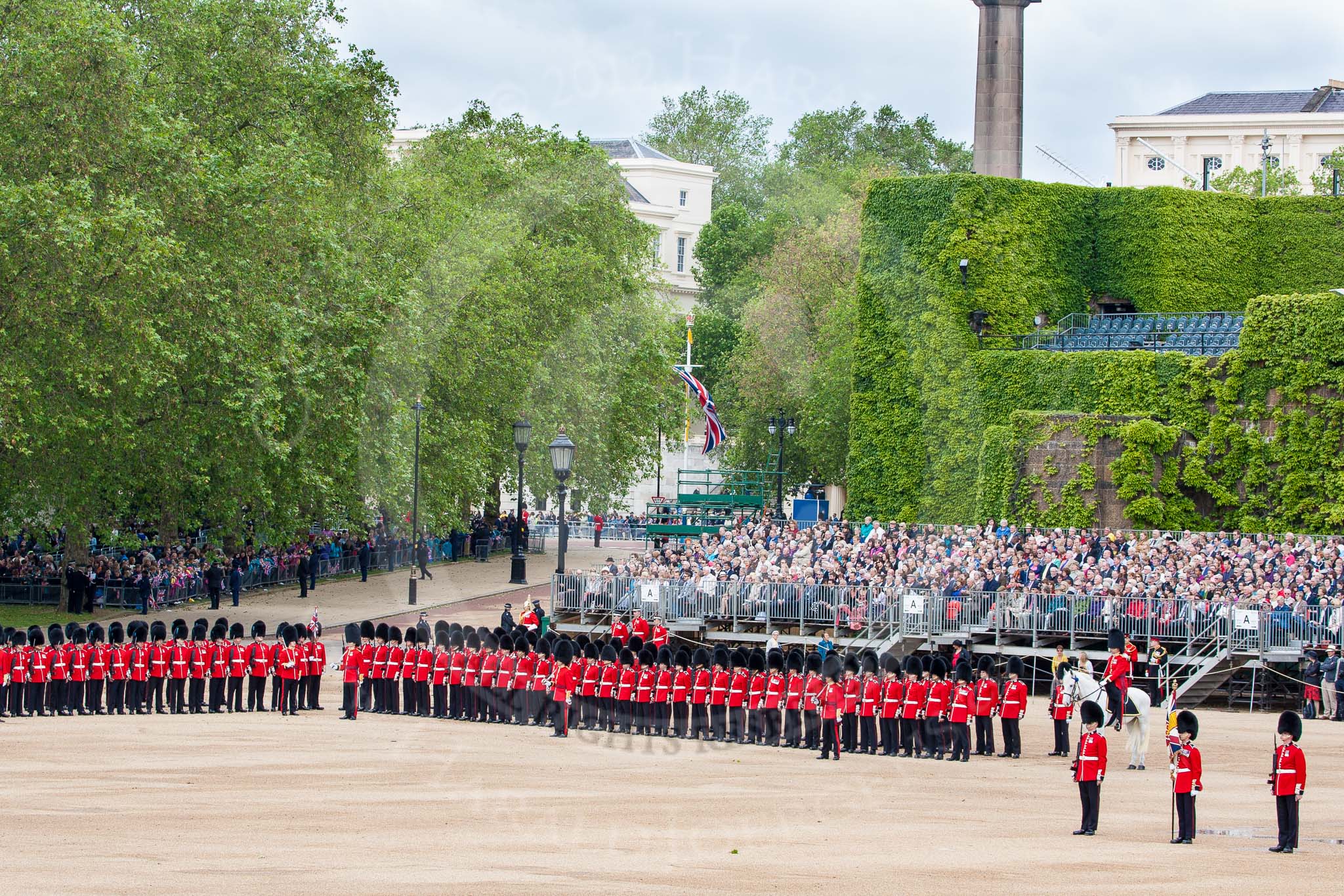 The Colonel's Review 2012: The Northern (St James's Park) side of Horse Guards Parade, with the road leading to the Mall on the left of the grandstand. On the very right of the photo: The Colour Sergeant with the two Ensigns, and the Adjutant of the parade..
Horse Guards Parade, Westminster,
London SW1,

United Kingdom,
on 09 June 2012 at 10:42, image #113
