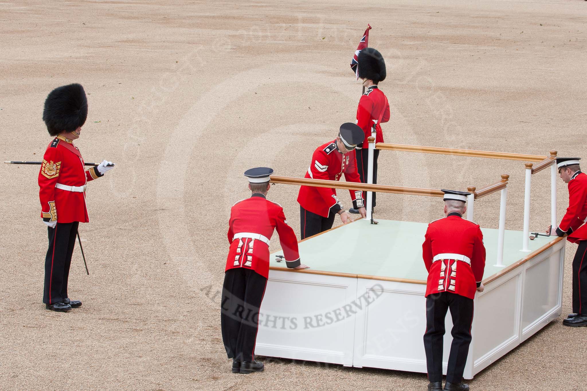 The Colonel's Review 2012: The saluting base is moved into position, in front of Horse Guards Arch, after the two carriages with members of the Royal family have passed. On the left GSM 'Billy' Mott..
Horse Guards Parade, Westminster,
London SW1,

United Kingdom,
on 09 June 2012 at 10:50, image #127