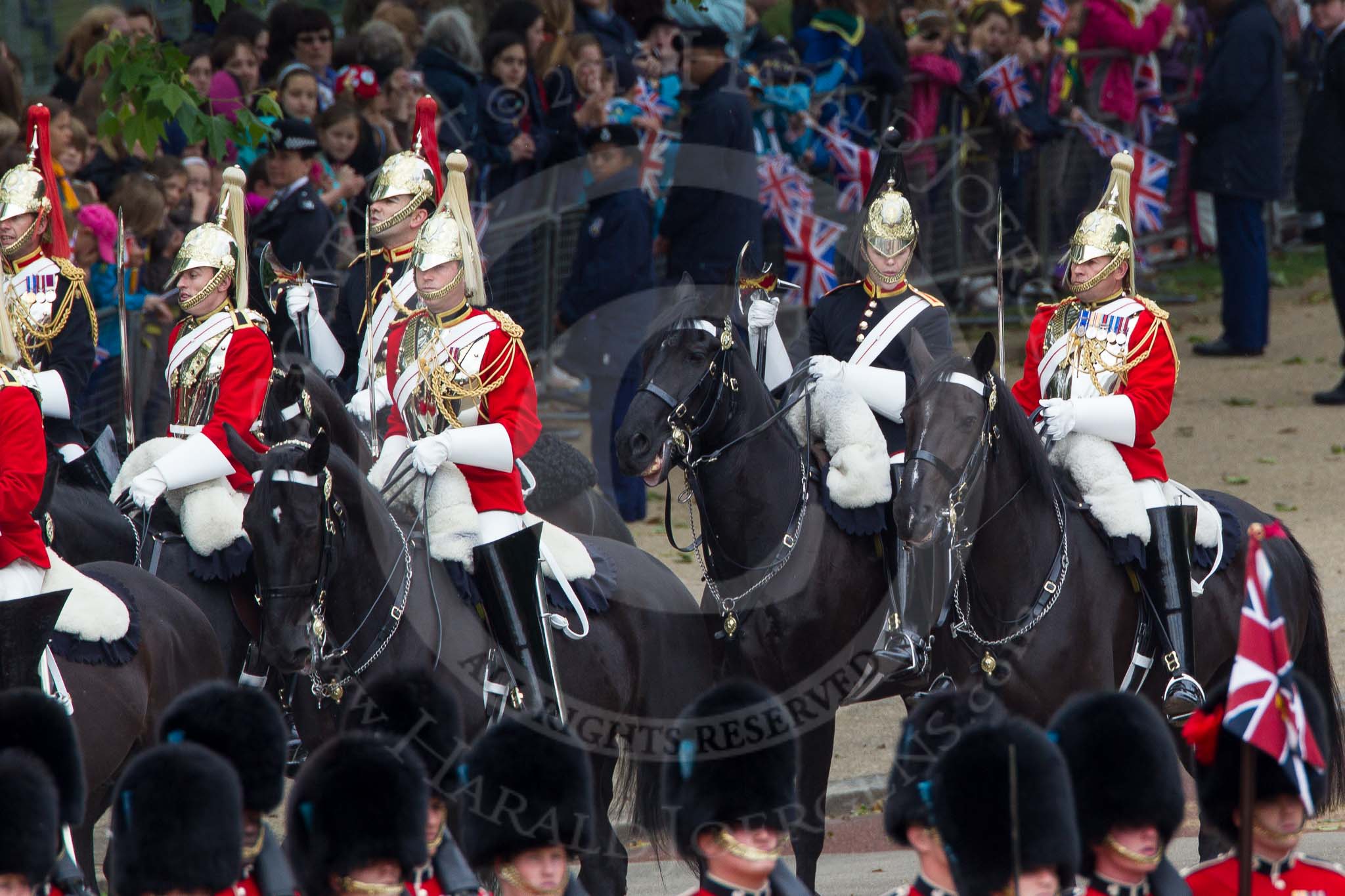 The Colonel's Review 2012: Two Farriers, with their black uniforms and shiny axes, at the rear of the Fourth Division of the Souvereign's Escort, the Life Guards..
Horse Guards Parade, Westminster,
London SW1,

United Kingdom,
on 09 June 2012 at 10:58, image #160