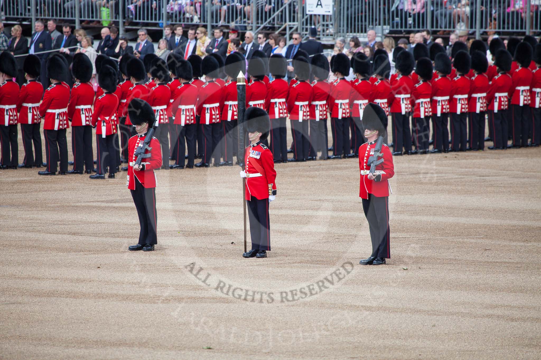 Trooping the Colour 2012: The Colour Party in position at the Eastern side of Horse Guards Parade. Colour Sereant Paul Baines MC with the two sentries, guardsmen Gareth Effrington and Kyle Dunbarth..
Horse Guards Parade, Westminster,
London SW1,

United Kingdom,
on 16 June 2012 at 10:32, image #74