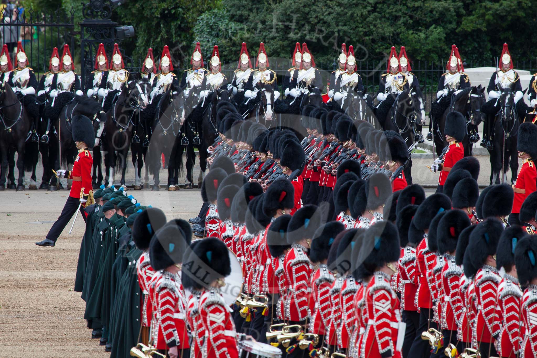 Trooping the Colour 2012: The Massed bands during the March Past. No. 5 Guard, 1st Battalion Irish Guards, marching to the left, with Irish Guards musicians (here the drummers and pipers) marching, as part os the Massed Bands, to the right..
Horse Guards Parade, Westminster,
London SW1,

United Kingdom,
on 16 June 2012 at 11:33, image #385