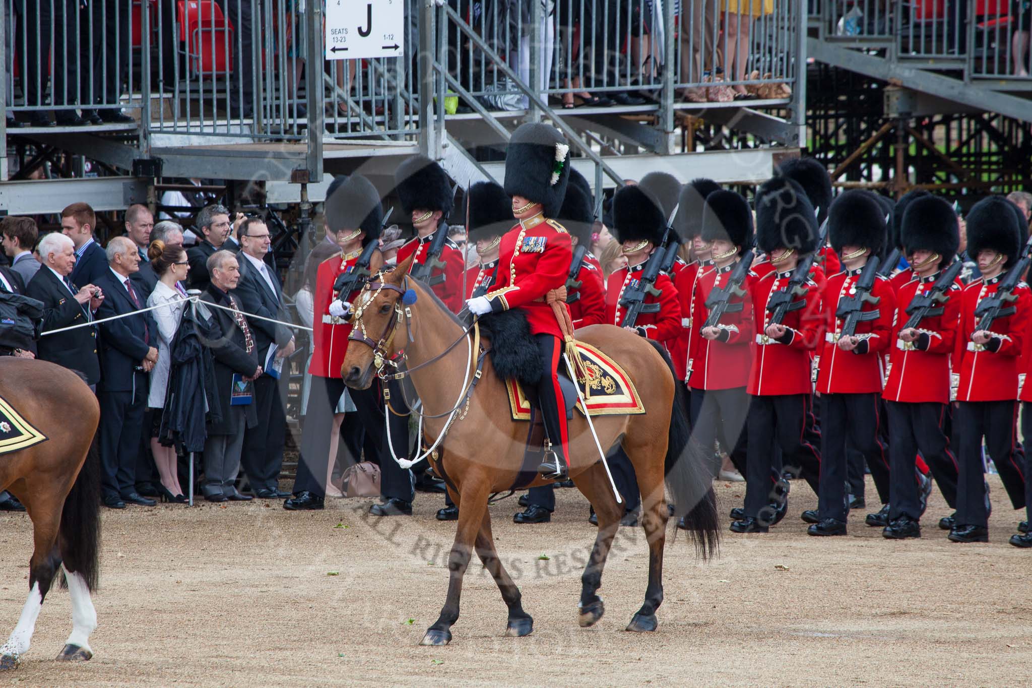 Trooping the Colour 2012: Following the Field Officer during the March Past, the Major of the Parade, Major Mark Lewis, Welsh Guards. Behind him No. 1 Guard, the Escort to the Colour..
Horse Guards Parade, Westminster,
London SW1,

United Kingdom,
on 16 June 2012 at 11:34, image #391