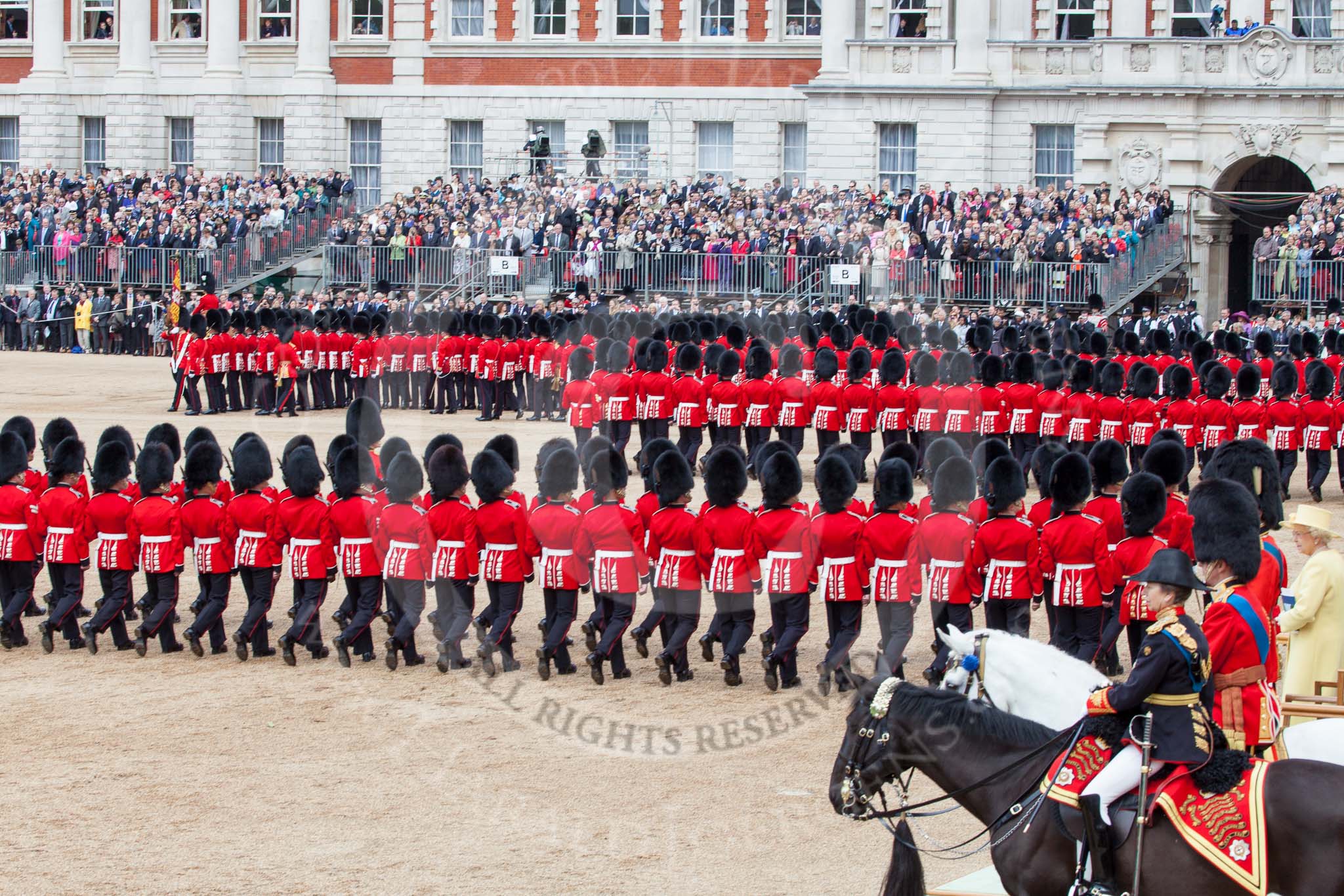 Trooping the Colour 2012: After all guards divisions have marched past Her Majesty in slow time, they are abot to march around Horse Guards parade again in quick time. On the top left No. 1 Guard, the Escort to the Colour, with the Colour just visible..
Horse Guards Parade, Westminster,
London SW1,

United Kingdom,
on 16 June 2012 at 11:38, image #440