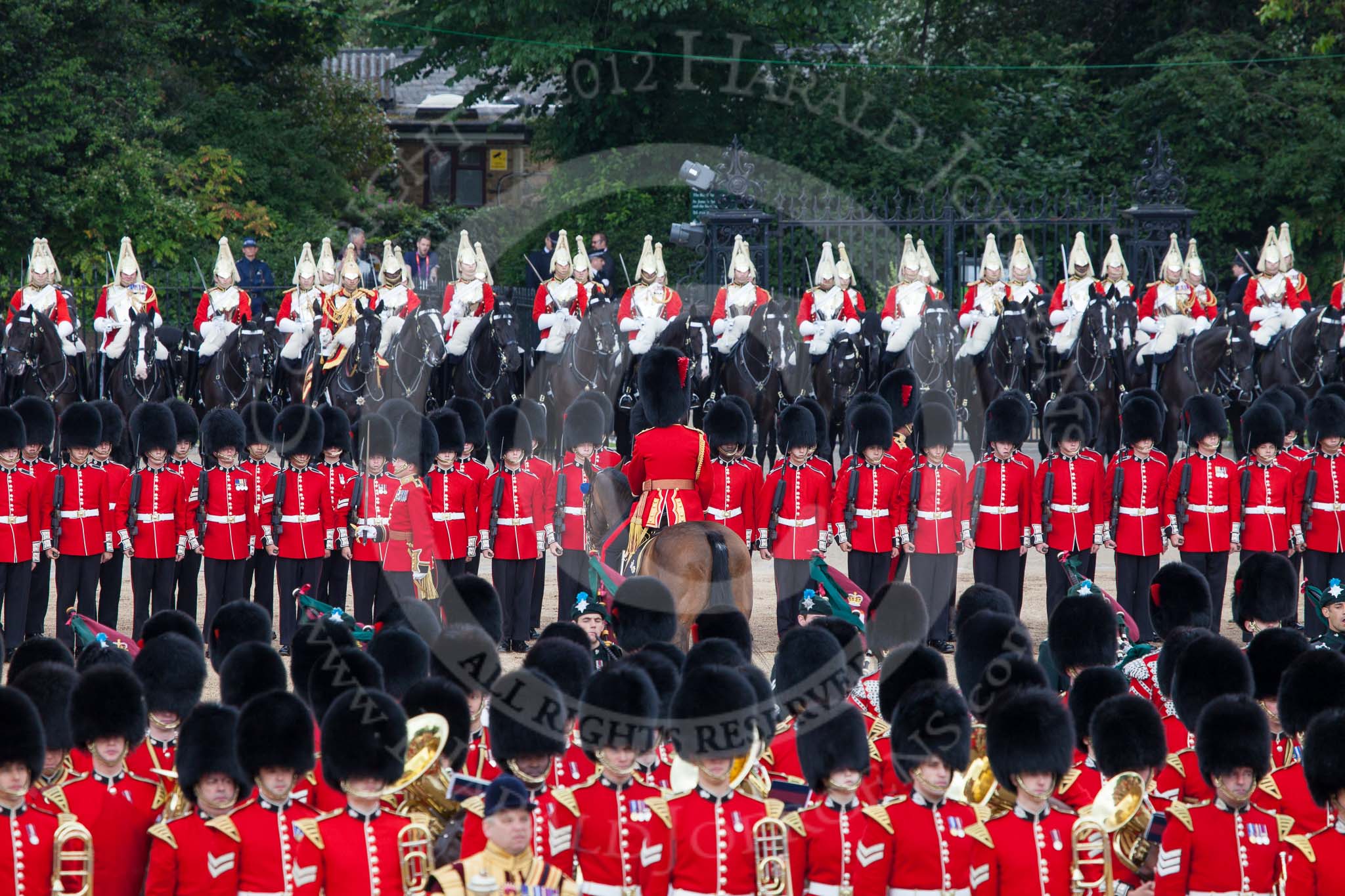 Trooping the Colour 2012: The line of guardsmen has been closed again. In the background The Life Guards on their horses, then the two rows of guardsmen, and in front the Massed Bands..
Horse Guards Parade, Westminster,
London SW1,

United Kingdom,
on 16 June 2012 at 11:50, image #518