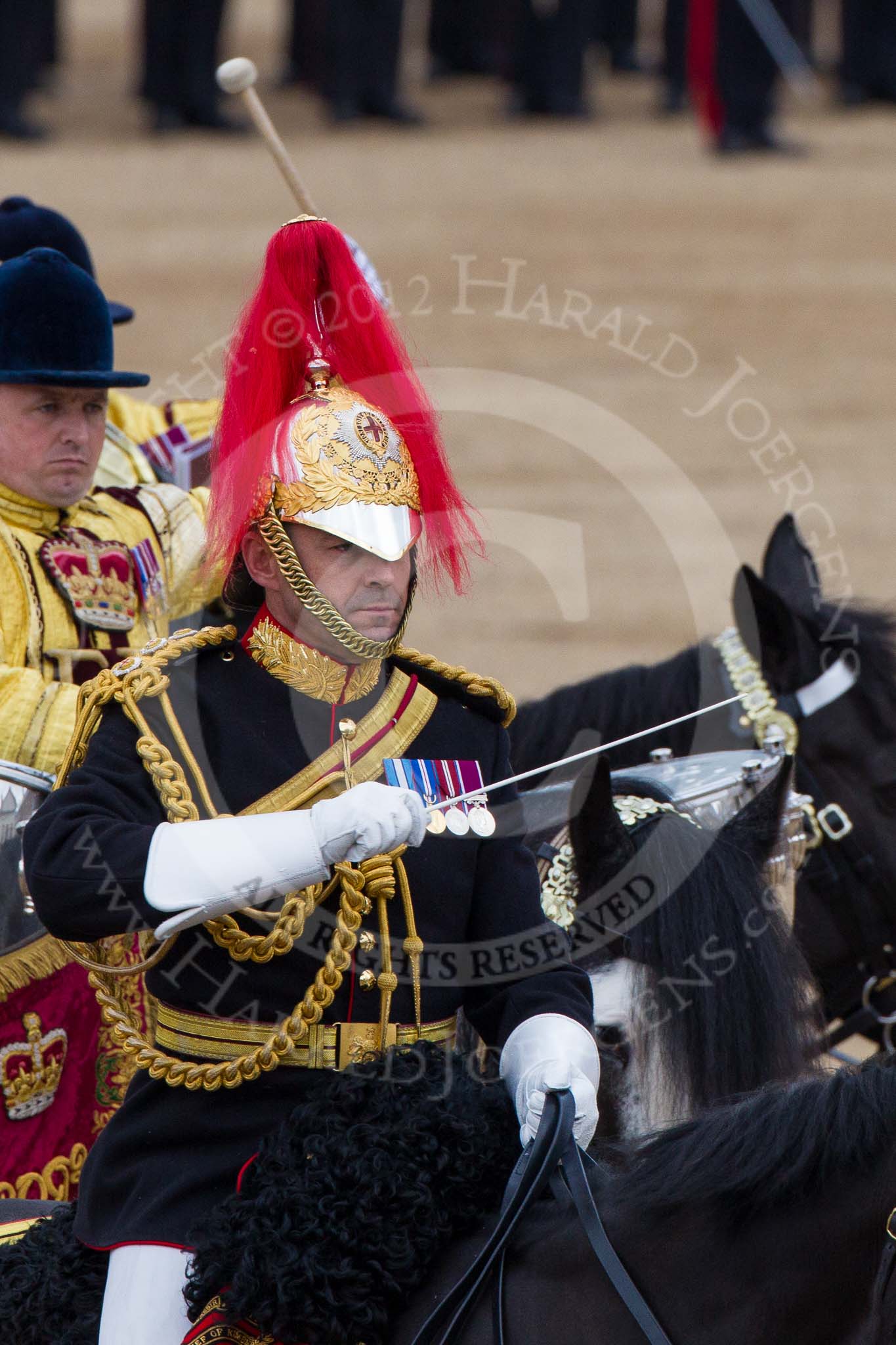 Trooping the Colour 2012: The Directors of Music of the Mounted Bands, Captain J Griffiths, The Blues and Royals..
Horse Guards Parade, Westminster,
London SW1,

United Kingdom,
on 16 June 2012 at 11:57, image #576