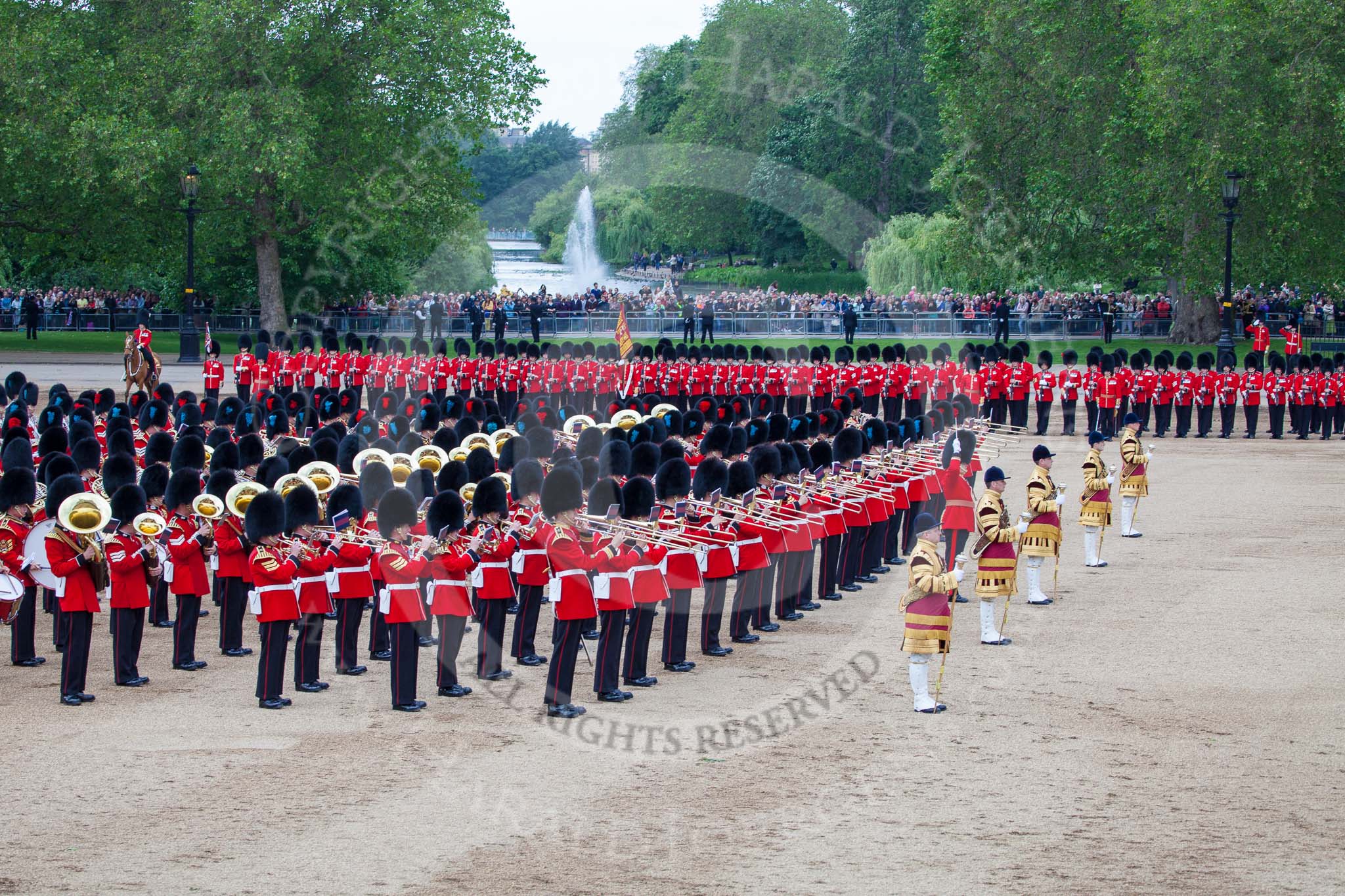 Trooping the Colour 2012: The Massed Bands playing between the Ride Past and March Off. In the centre of the photo, seen in front of the fountain in St. James's Park, the Ensign with the Colour..
Horse Guards Parade, Westminster,
London SW1,

United Kingdom,
on 16 June 2012 at 12:02, image #612
