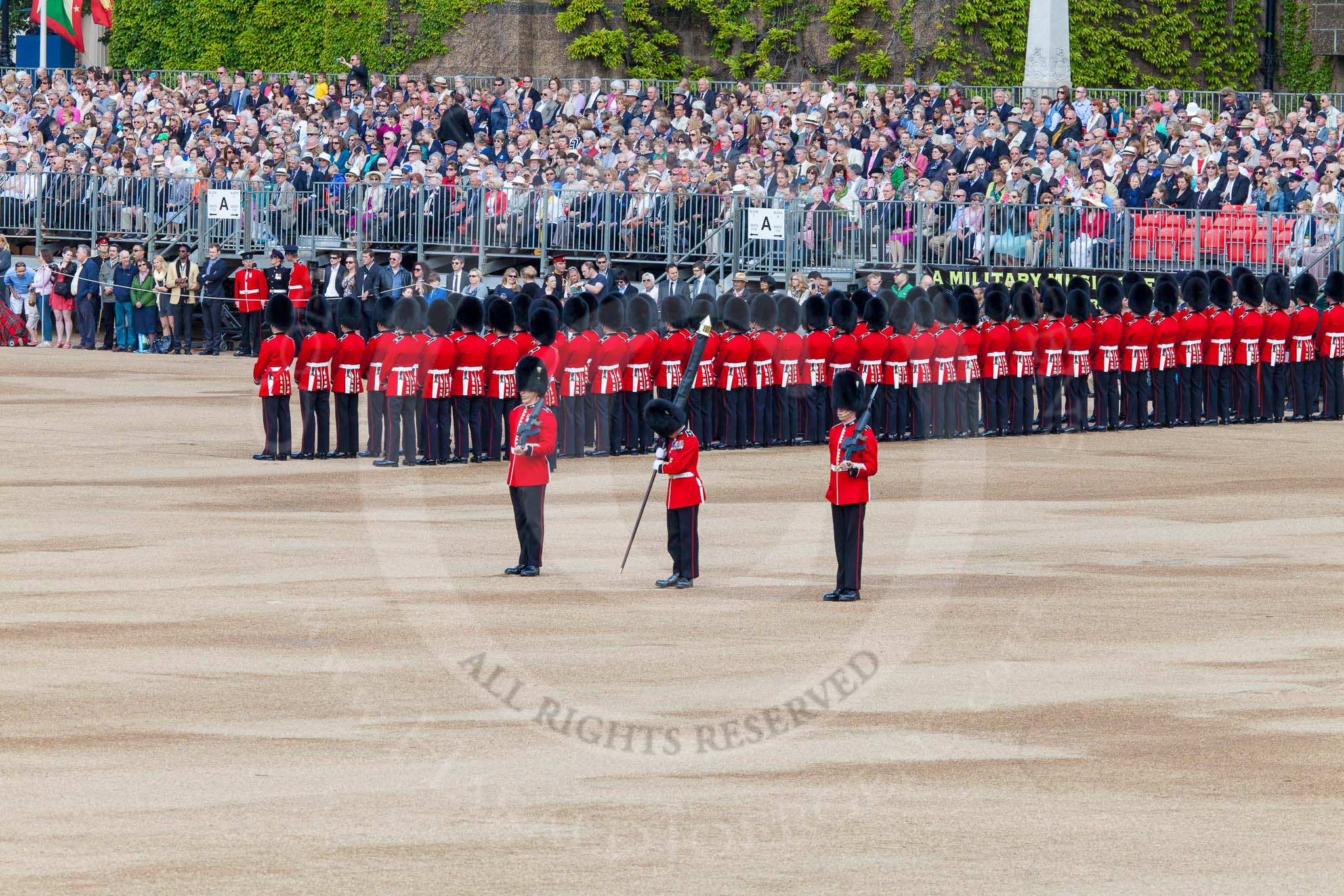 The Colonel's Review 2013: The Colour Party has reached their position on Horse Guards Parade - Colour Sergeant R J Heath, Welsh Guards, carrying the Colour, and the two sentries..
Horse Guards Parade, Westminster,
London SW1,

United Kingdom,
on 08 June 2013 at 10:32, image #133