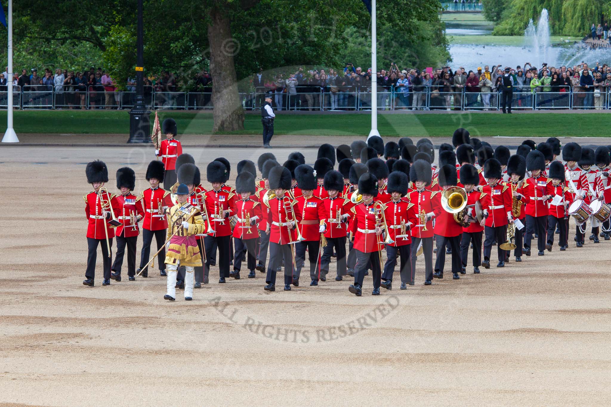 The Colonel's Review 2013: Drum Major Neill Lawman, Welsh Guards, leading the Band of the Welsh Guards onto Horse Guards Parade, along the line of spectators at St James's Park..
Horse Guards Parade, Westminster,
London SW1,

United Kingdom,
on 08 June 2013 at 10:32, image #134