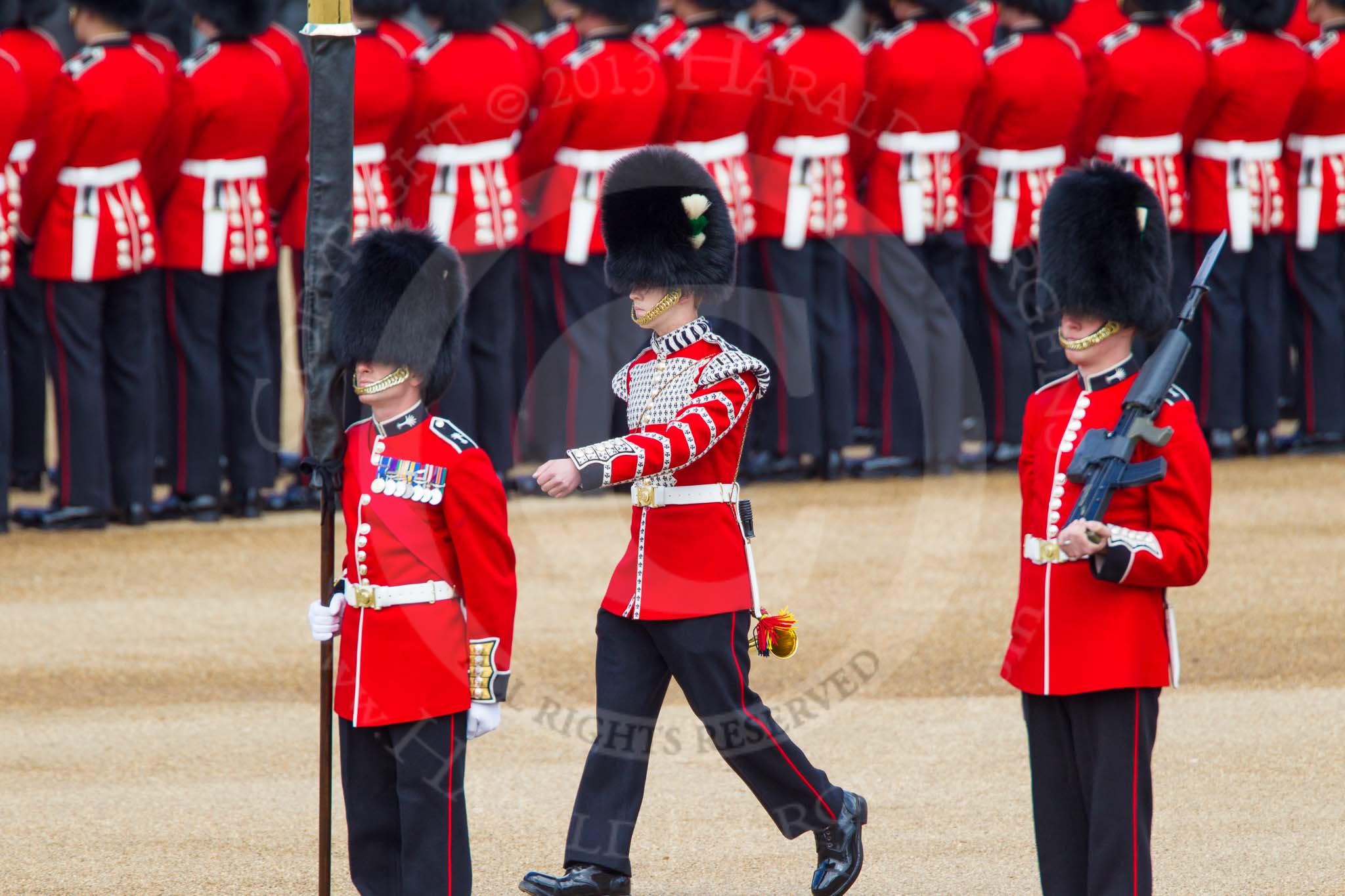 The Colonel's Review 2013: Welsh Guards Drummer approaching Colour Sergeant R J Heath, Welsh Guards, carrying the Colour and the two sentries..
Horse Guards Parade, Westminster,
London SW1,

United Kingdom,
on 08 June 2013 at 10:32, image #138