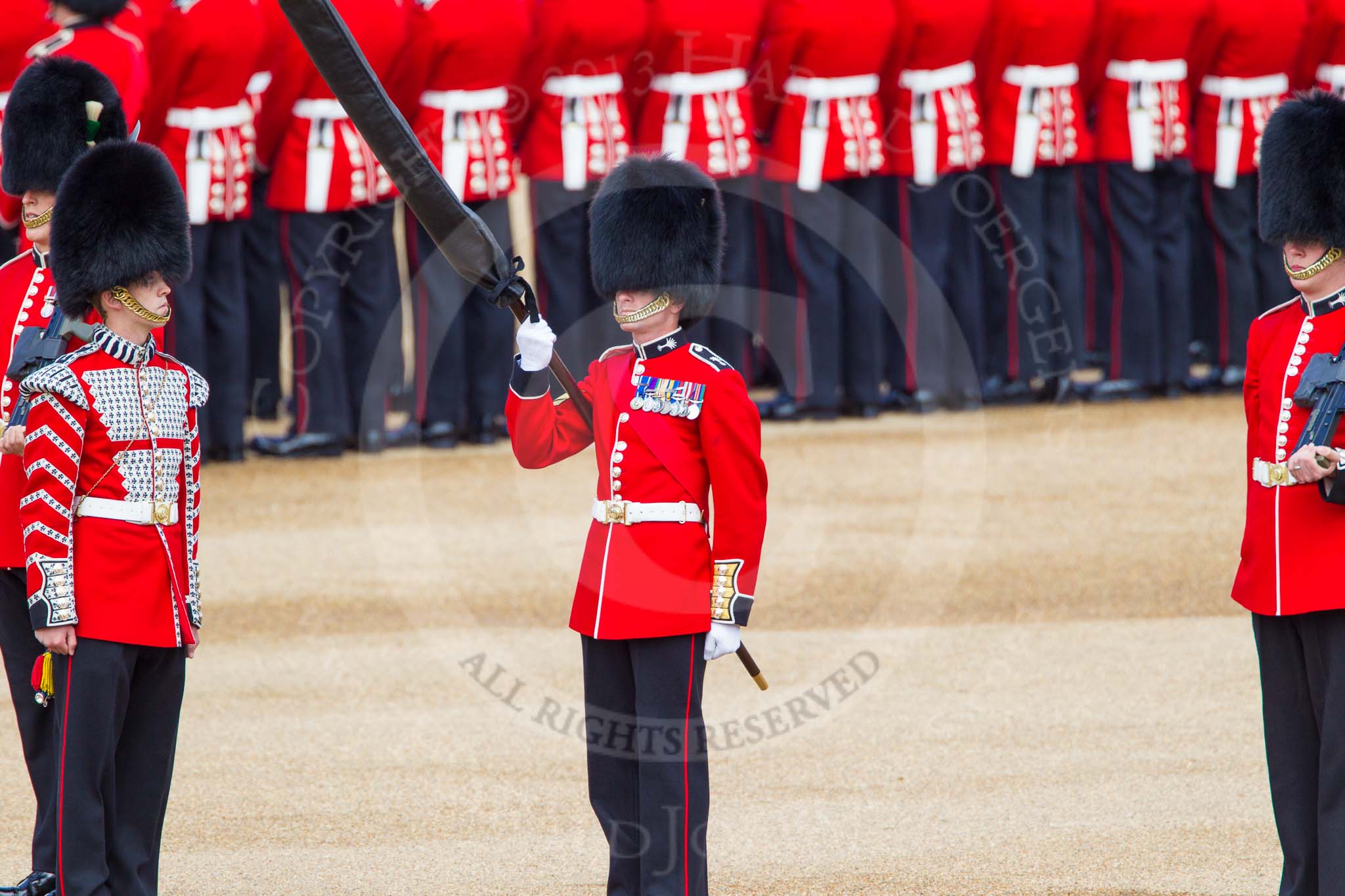 The Colonel's Review 2013: Welsh Guards Drummer approaching Colour Sergeant R J Heath, Welsh Guards, carrying the Colour and the two sentries..
Horse Guards Parade, Westminster,
London SW1,

United Kingdom,
on 08 June 2013 at 10:33, image #142