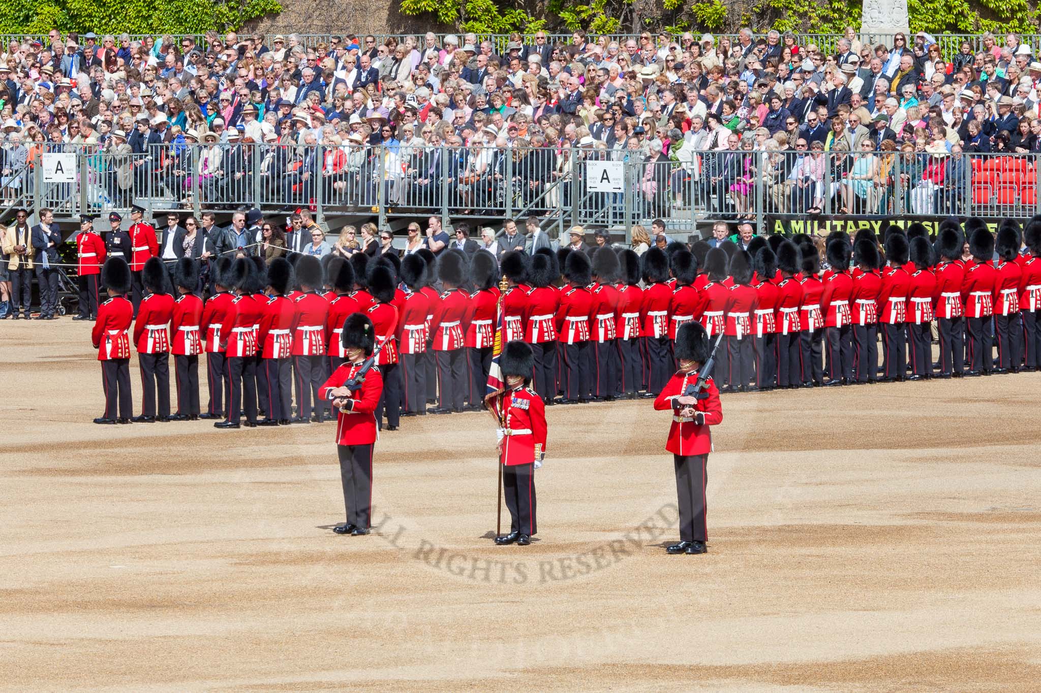 The Colonel's Review 2013: The Colour is now uncased, and the two sentries patrol to the left and right, to protect the Colour..
Horse Guards Parade, Westminster,
London SW1,

United Kingdom,
on 08 June 2013 at 10:34, image #160