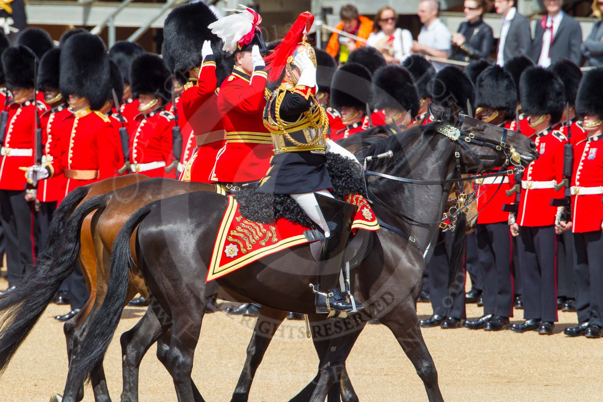 The Colonel's Review 2013: The Silver-Stick-in-Waiting, Colonel Stuart Cowen, The Blues and Royals, the Chief of Staff, Colonel Hugh Bodington, Welsh Guards, and Aide-de-Camp, Captain John James Hathaway-White, Grenadier Guards, saluting the Colour during the Inspection of the Line..
Horse Guards Parade, Westminster,
London SW1,

United Kingdom,
on 08 June 2013 at 11:04, image #370