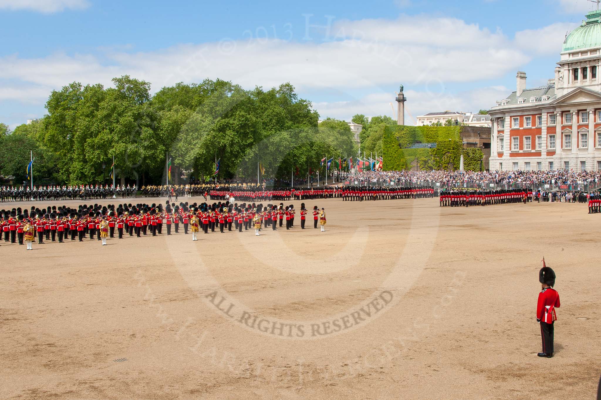 The Colonel's Review 2013: The Massed Bands, in the centre of Horse Guards Parade during the March Past, with the guards, on the very right of the image, march around them..
Horse Guards Parade, Westminster,
London SW1,

United Kingdom,
on 08 June 2013 at 11:39, image #673