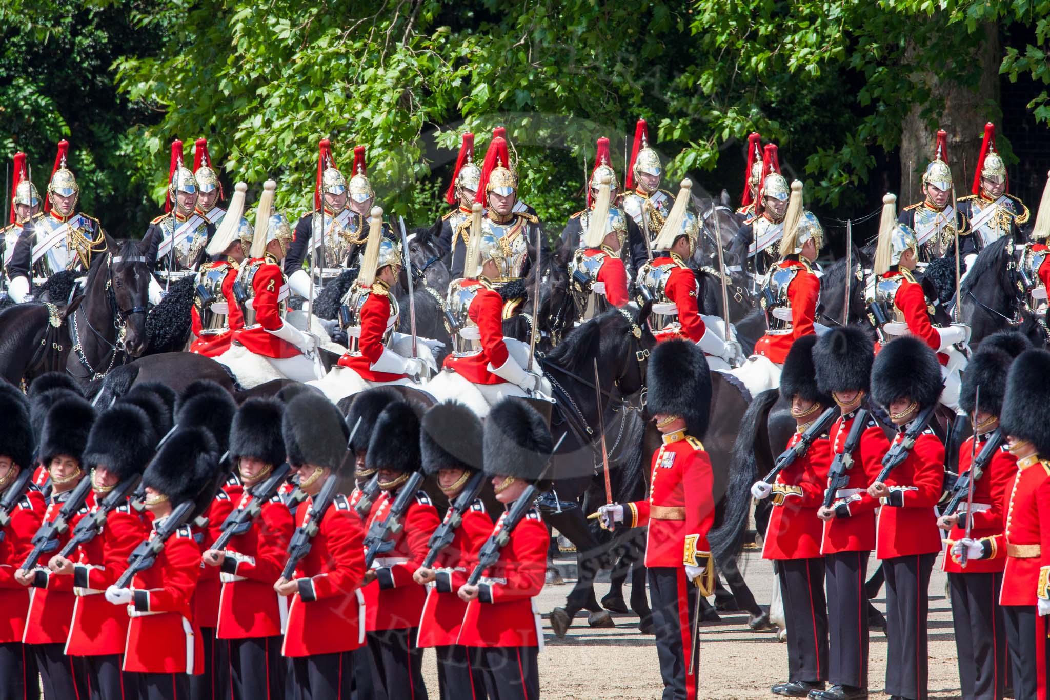 The Colonel's Review 2013: The Household Cavalry is marching off whilst the foot guards are waiting for the command by the Field Officer..
Horse Guards Parade, Westminster,
London SW1,

United Kingdom,
on 08 June 2013 at 12:05, image #818