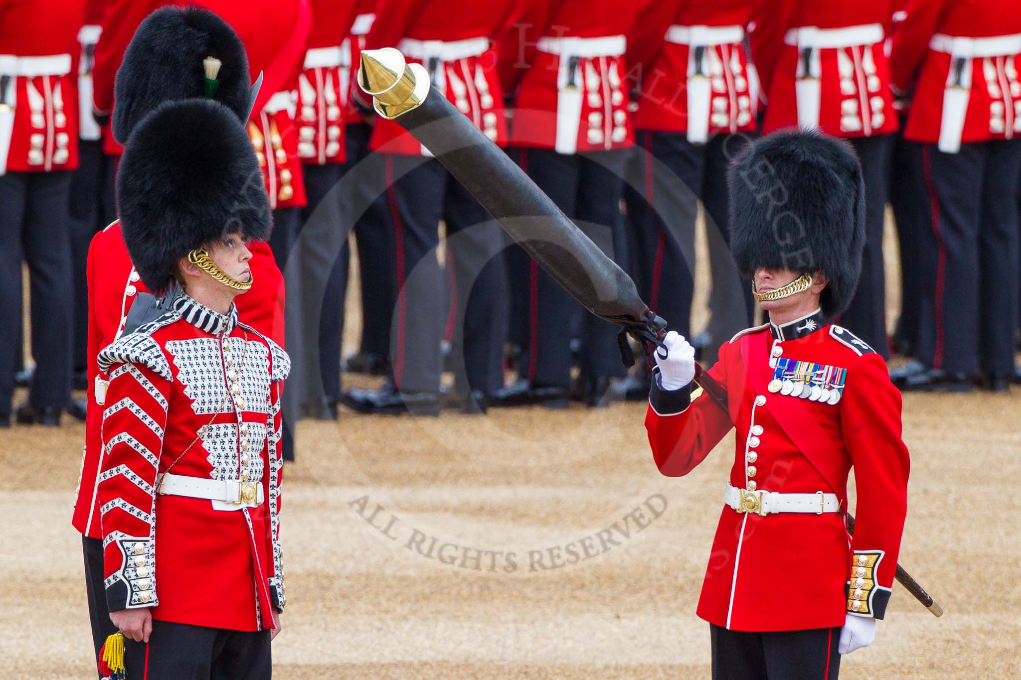 Major General's Review 2013: Welsh Guards Drummer approaching Colour Sergeant R J Heath, Welsh Guards, carrying the Colour and the two sentries..
Horse Guards Parade, Westminster,
London SW1,

United Kingdom,
on 01 June 2013 at 10:32, image #123