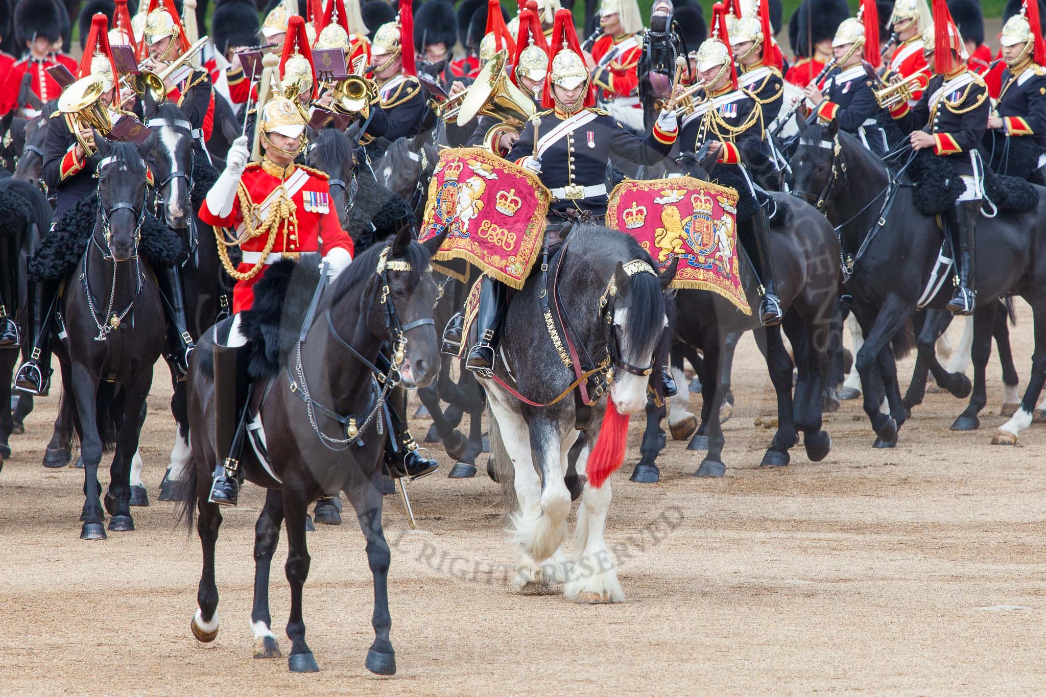 Major General's Review 2013: The Director of Music of the Household Cavalry, Major Paul Wilman, The Life Guards, during the Mounted Troops Ride Past. Behind him the kettle drummer from The Blues and Royals..
Horse Guards Parade, Westminster,
London SW1,

United Kingdom,
on 01 June 2013 at 11:50, image #581