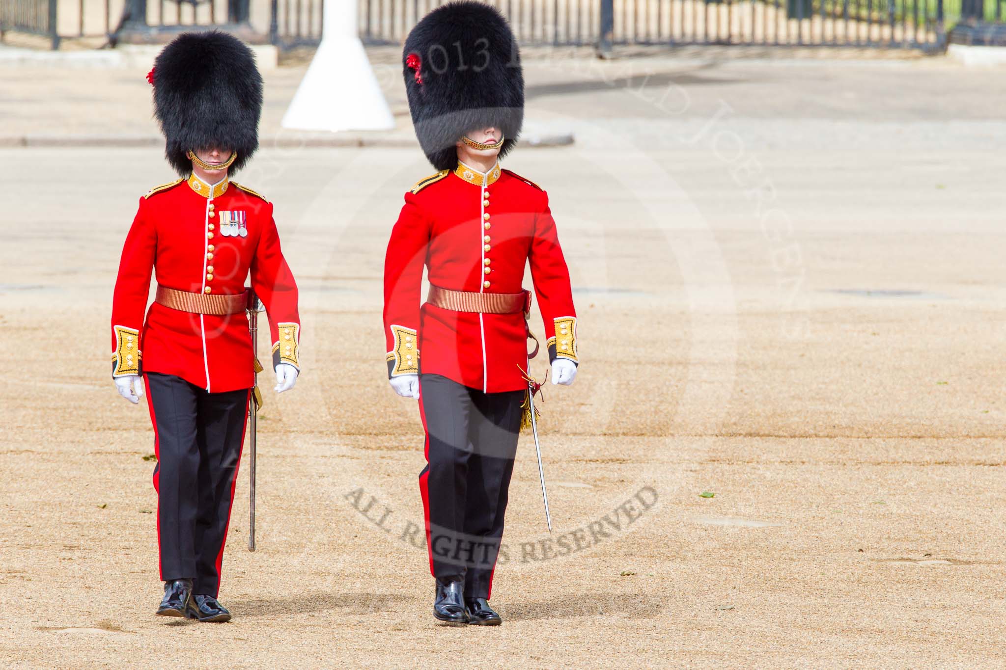 Trooping the Colour 2013: Major T P Y Radcliffe and Second Lieutenant J C Olley, No. 6 Guard, No. 7 Company Coldstream Guards, following the Keepers of the Ground to Horse Guards Arch. Image #33, 15 June 2013 09:57 Horse Guards Parade, London, UK