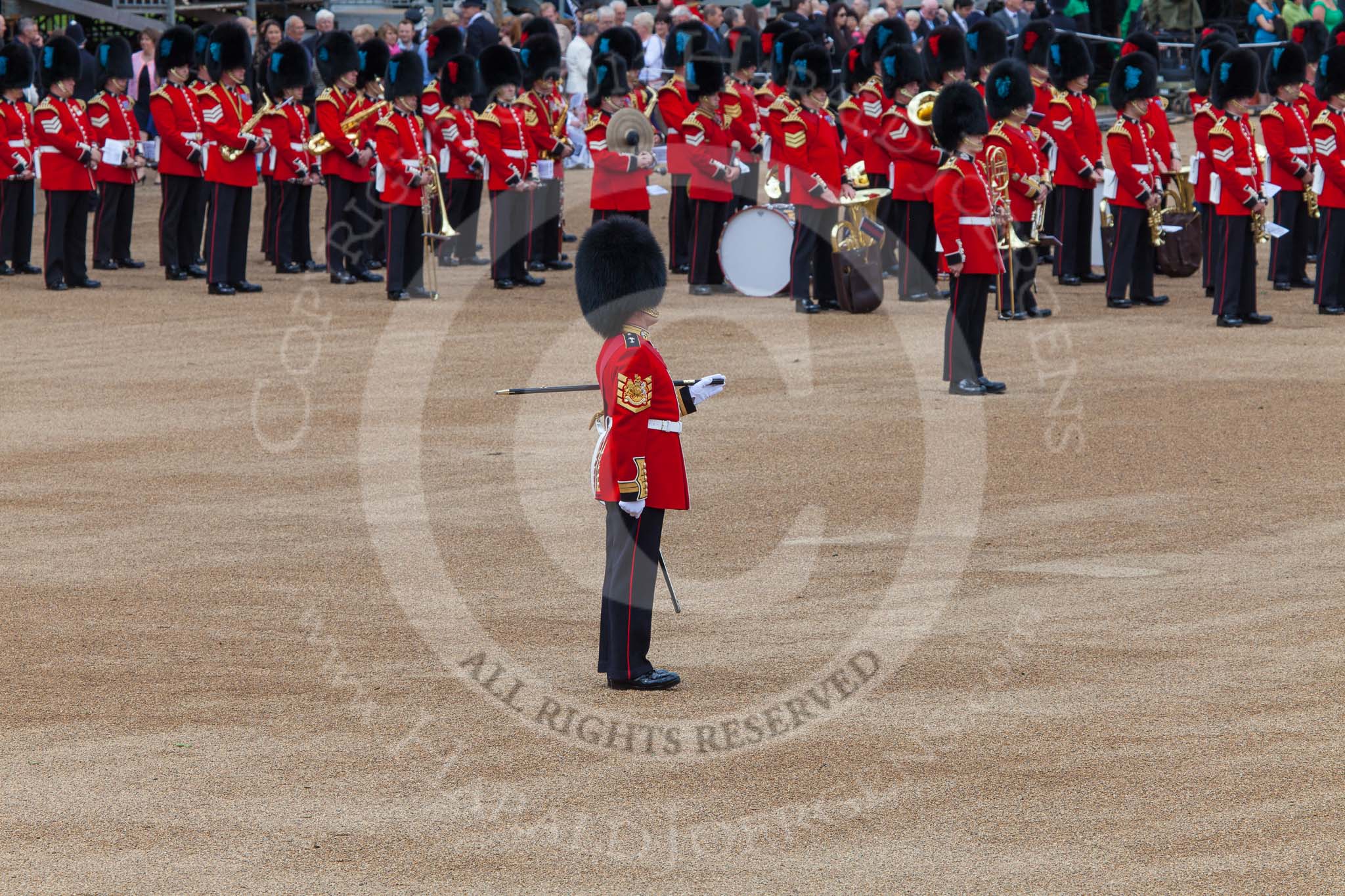 Trooping the Colour 2013: WO1 Garrison Sergeant Major William 'Bill' Mott OBE MVO, Welsh Guards, standing next to the Bands of the Irish and Coldstream Guards. Image #65, 15 June 2013 10:21 Horse Guards Parade, London, UK