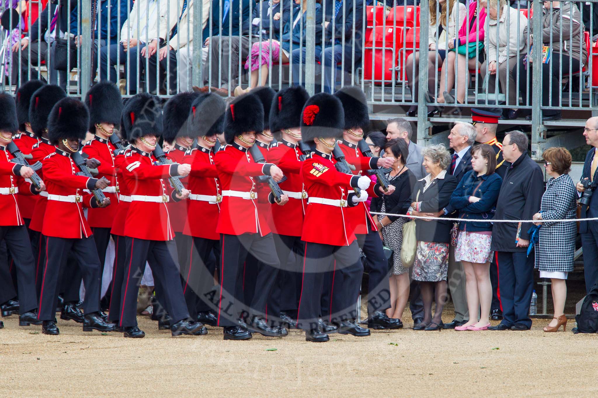 Trooping the Colour 2013: No. 6 Guard, No. 7 Company Coldstream Guards are marching along the lines of spectators onto Horse Guards Parade. Image #73, 15 June 2013 10:22 Horse Guards Parade, London, UK