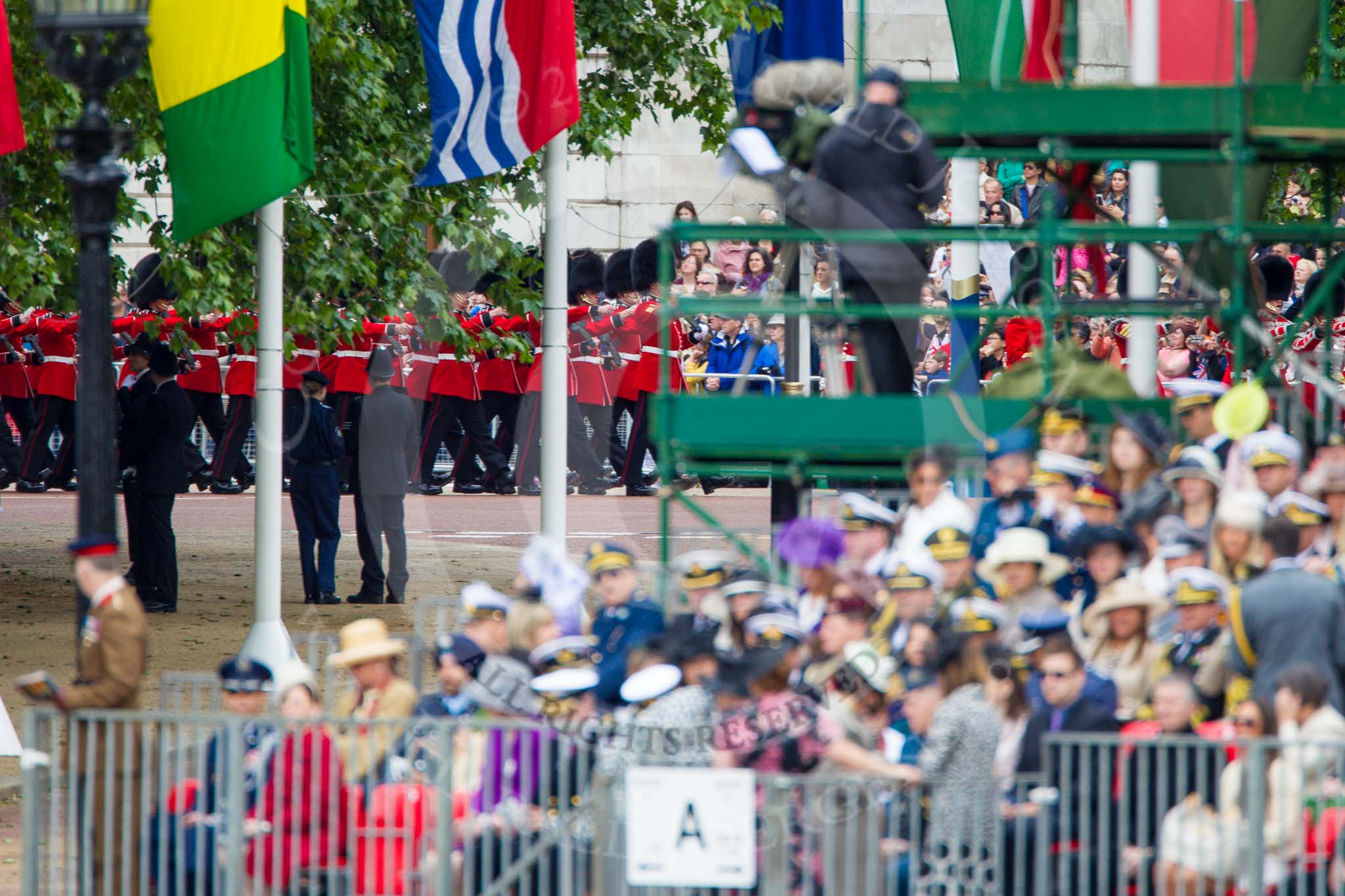 Trooping the Colour 2013: The next band and guard can be seen marching on The Mall before they turn towards Horse Guards Parade. Image #83, 15 June 2013 10:25 Horse Guards Parade, London, UK