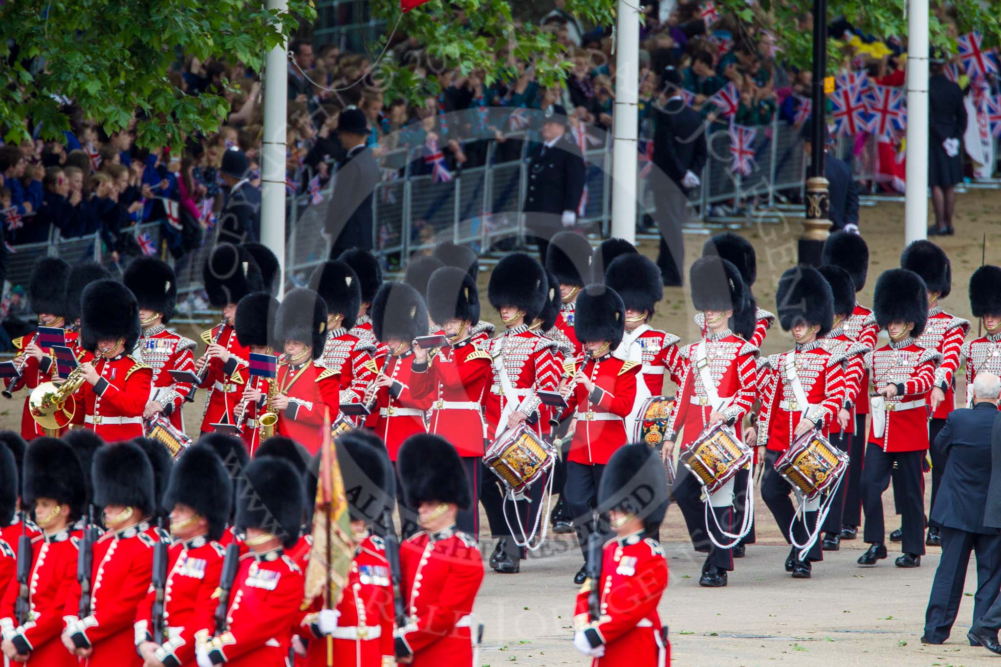 Trooping the Colour 2013: The Band of the Grenadier Guards marches past No. 5 Guard, F Company Scots Guards, on the northern side of Horse Guards Parade. Image #88, 15 June 2013 10:27 Horse Guards Parade, London, UK