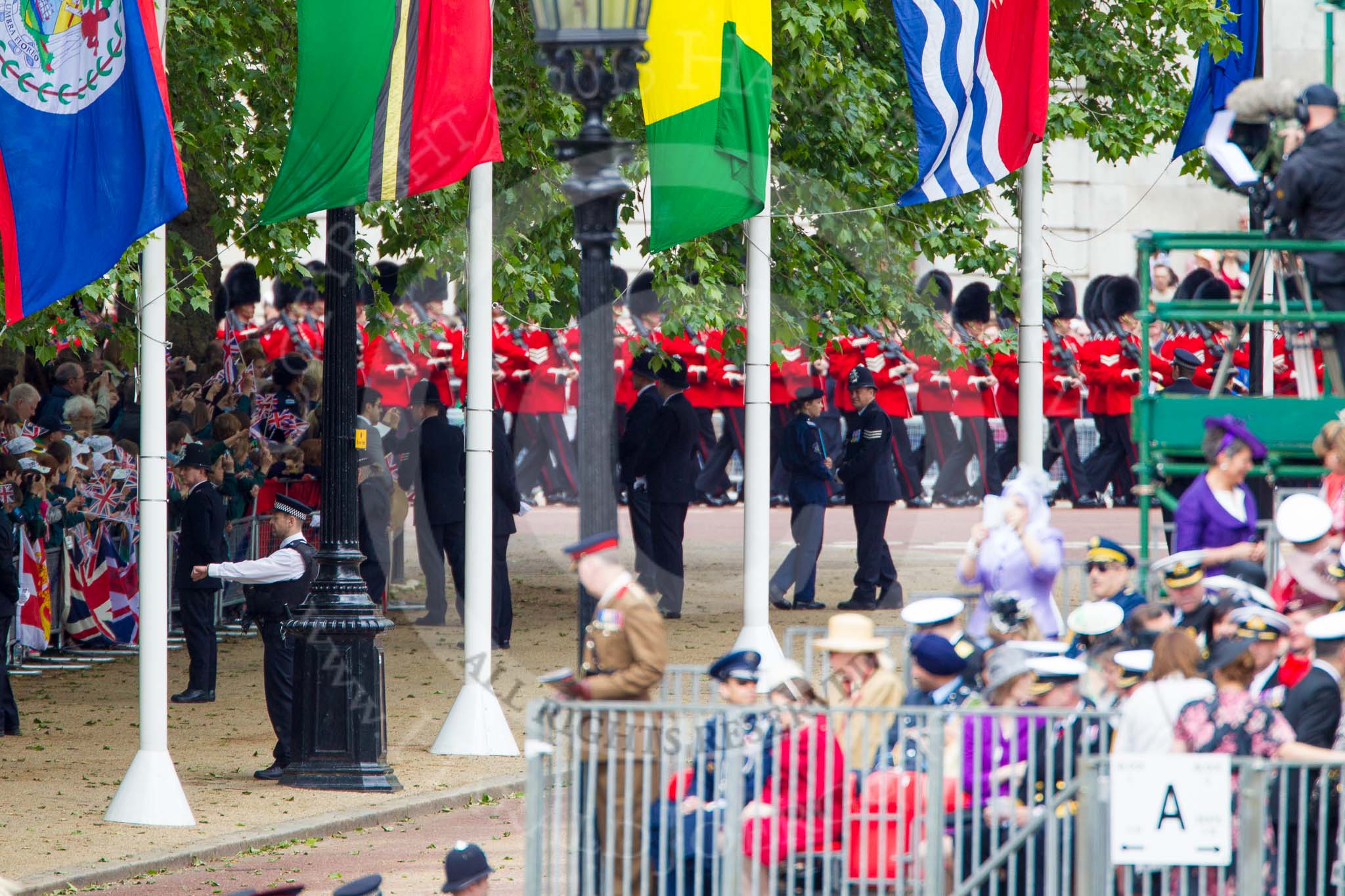 Trooping the Colour 2013: The last of the bands, and the last two guards, can be seen marching on The Mall before turning towards Horse Guards Parade. Image #96, 15 June 2013 10:28 Horse Guards Parade, London, UK