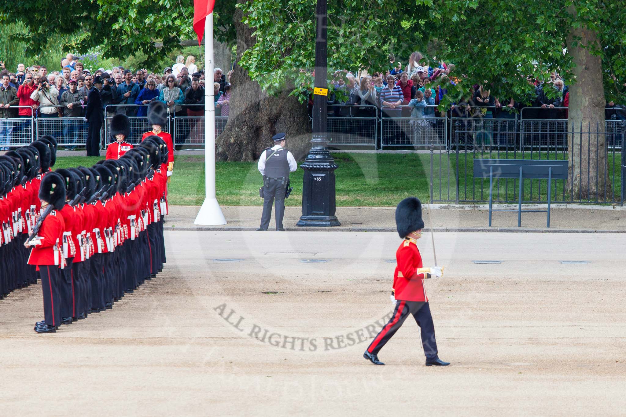 Trooping the Colour 2013: The Subaltern of No. 1 Guard, Captain F O Lloyd-George, who has been commanding the guard from Wellington Barracks to Horse Guards Parade, marches off to Horse Guards Arch, to return later with the other 17 officers, three for each guard. Image #118, 15 June 2013 10:33 Horse Guards Parade, London, UK