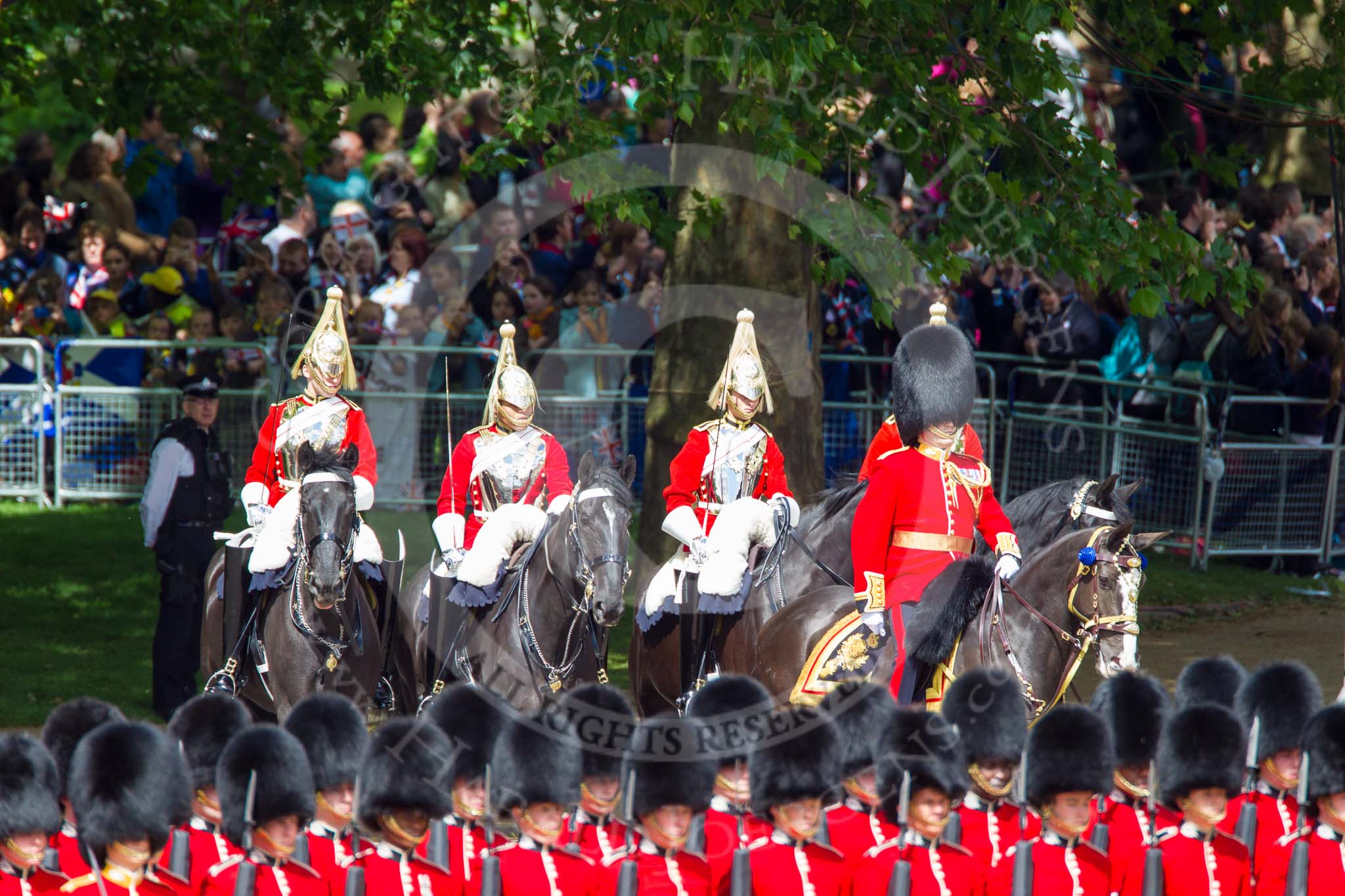 Trooping the Colour 2013: Brigade Major Household Division Lieutenant Colonel Simon Soskin, Grenadier Guards, followed by four Troopers of The Life Guards, leading the Royal Procession onto Horse Guards Parade. Image #230, 15 June 2013 10:56 Horse Guards Parade, London, UK