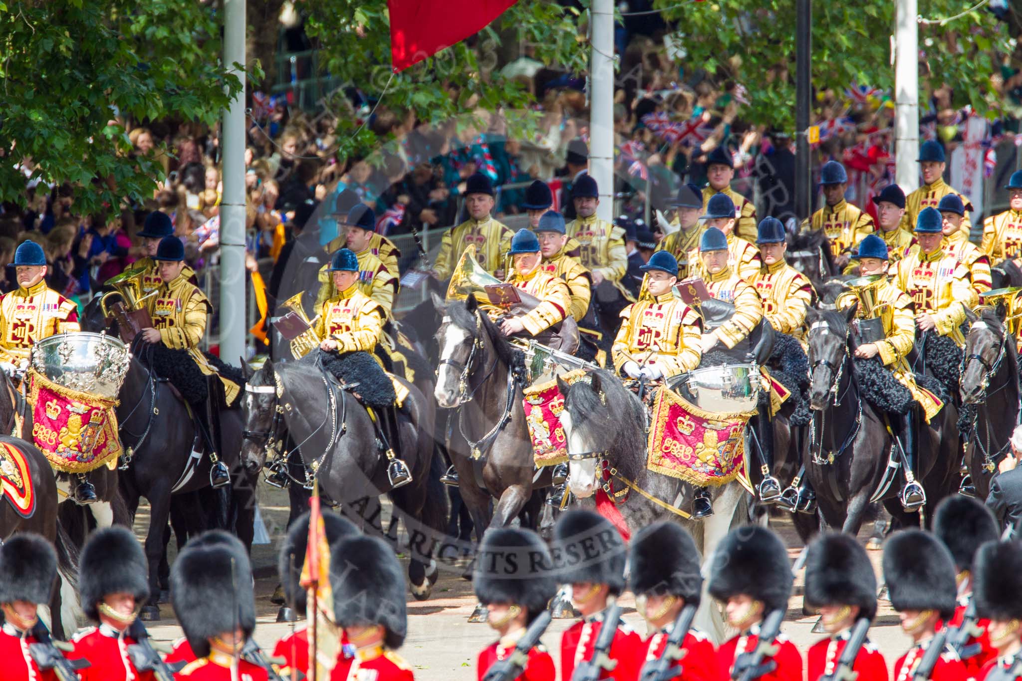 Trooping the Colour 2013: The Mounted Bands of the Household Cavalry are marching down Horse Guards Road as the third element of the Royal Procession, taking position at the northern side of Horse Guards Parade, next to St James's Park. Image #238, 15 June 2013 10:56 Horse Guards Parade, London, UK