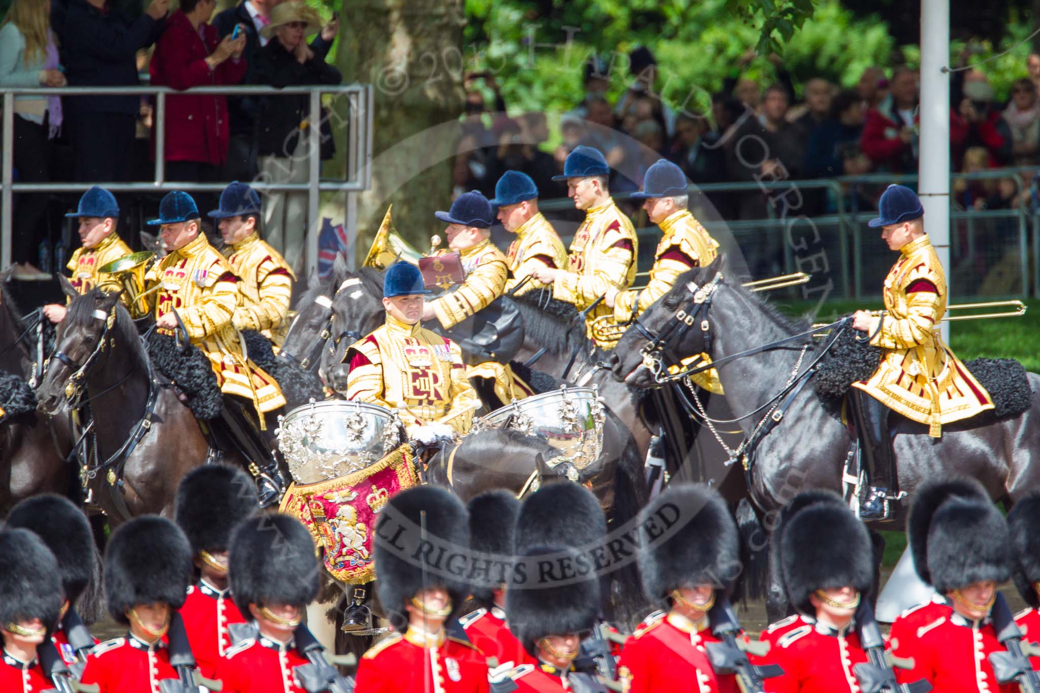 Trooping the Colour 2013: The Mounted Bands of the Household Cavalry are marching down Horse Guards Road as the third element of the Royal Procession, taking position at the northern side of Horse Guards Parade, next to St James's Park. In the centre the Life Guard's Kettle Drummer. Image #243, 15 June 2013 10:57 Horse Guards Parade, London, UK