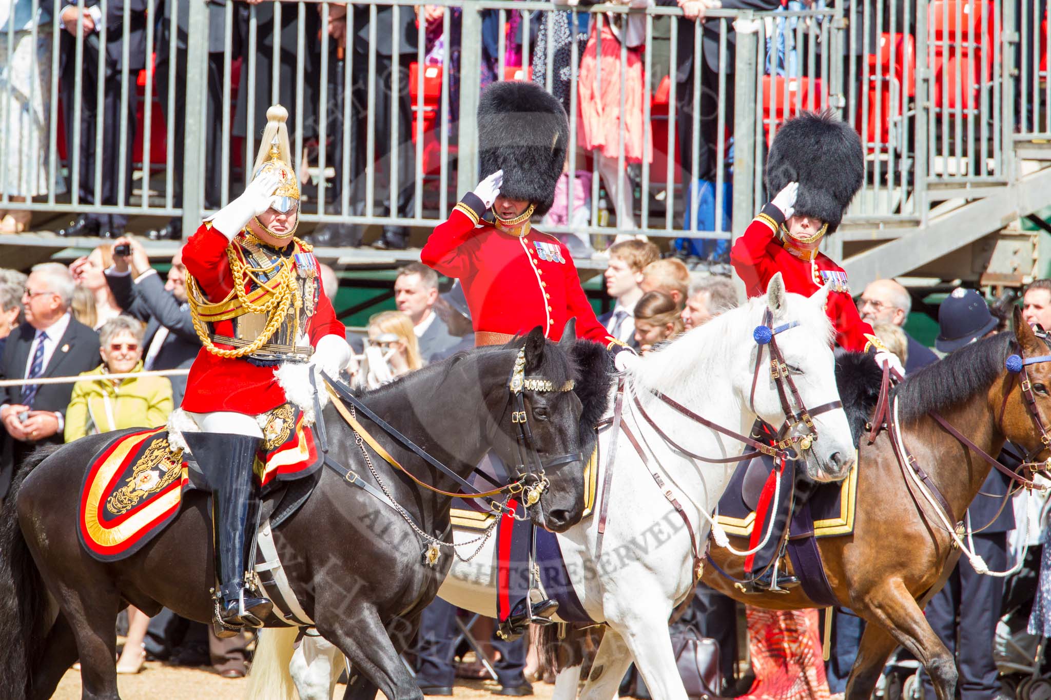 Trooping the Colour 2013: The Silver Stick Adjutant and Foot Guards Regimental Adjutants - Lieutenant Colonel H S J Scott, The Life Guards, Major G V A Baker. Grenadier Guards, and Lieutenant Colonel A W Foster, Scots Guards, saluting the Colour. Image #286, 15 June 2013 10:59 Horse Guards Parade, London, UK