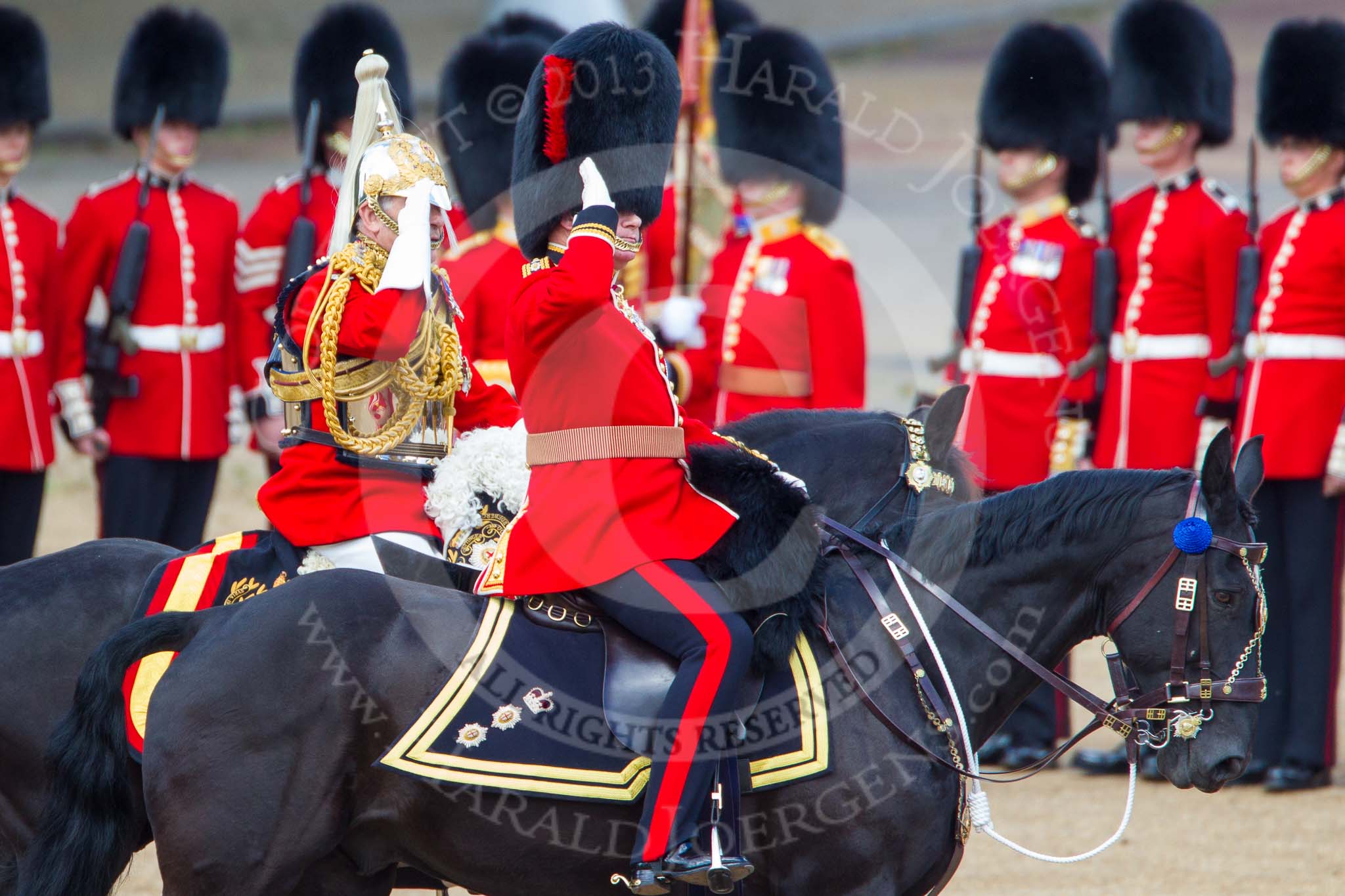 Trooping the Colour 2013: The Non-Royal Colonels, Colonel Coldstream Guards General Sir James Bucknall and Gold Stick in Waiting and Colonel Life Guards, Field Marshal the Lord Guthrie of Craigiebank, saluting the Colour during the Inspection of the Line. Image #338, 15 June 2013 11:04 Horse Guards Parade, London, UK