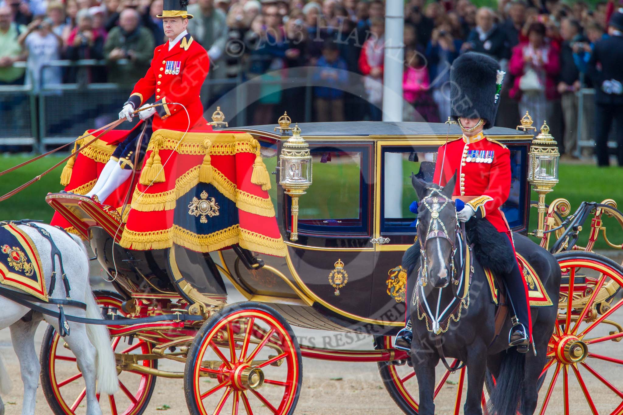 Trooping the Colour 2013: The Major of the Parade, Major H G C Bettinson, Welsh Guards, and the Glass Coach with HM The Queen passing behind him..
Horse Guards Parade, Westminster,
London SW1,

United Kingdom,
on 15 June 2013 at 11:06, image #353