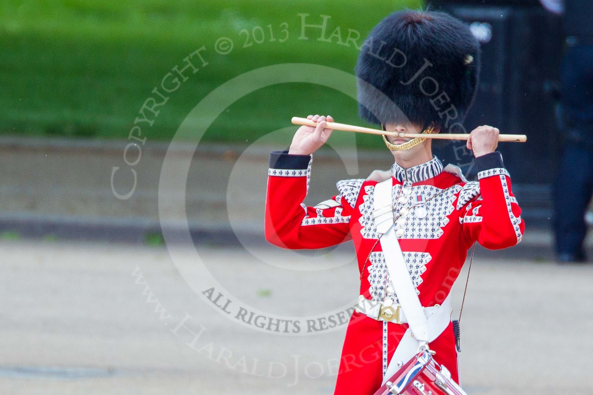 Trooping the Colour 2013: The "Lone Drummer", Lance Corporal Christopher Rees, salutes with his drumsticks before re-joining the band. Image #428, 15 June 2013 11:16 Horse Guards Parade, London, UK