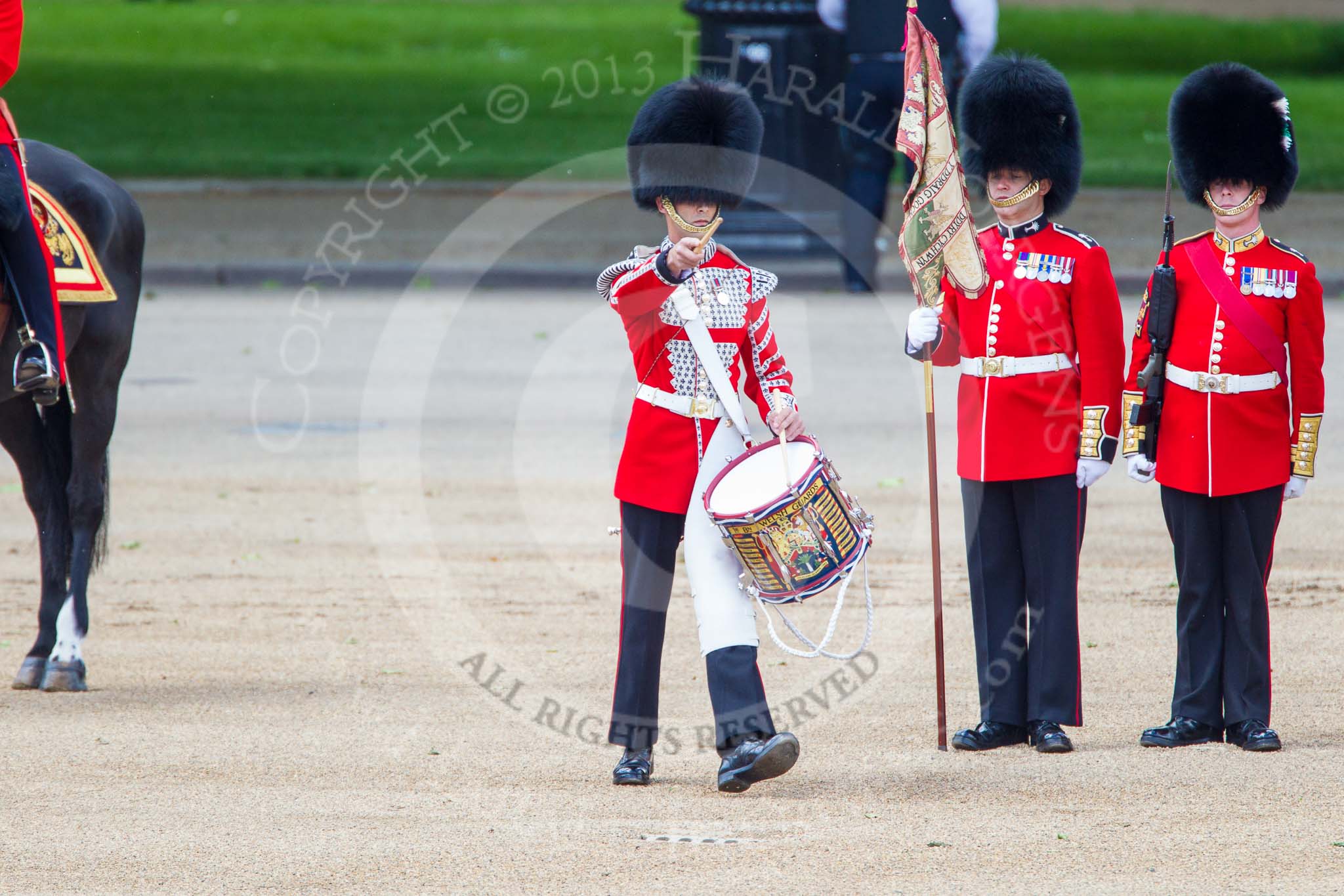 Trooping the Colour 2013: The "Lone Drummer", Lance Corporal Christopher Rees,  marches forward to re-join the band. Image #429, 15 June 2013 11:16 Horse Guards Parade, London, UK