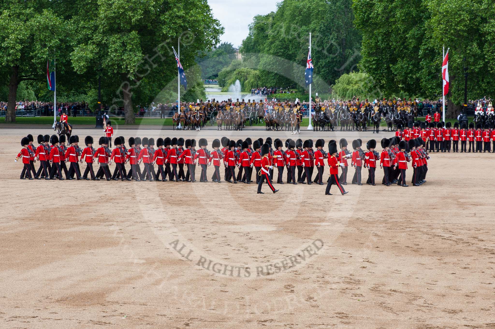 Trooping the Colour 2013: The men of No. 1 Guard (Escort for the Colour),1st Battalion Welsh Guards are moving into a new formation, facing the Coloir Party on the other side of Horse Guards Parade. Image #439, 15 June 2013 11:18 Horse Guards Parade, London, UK
