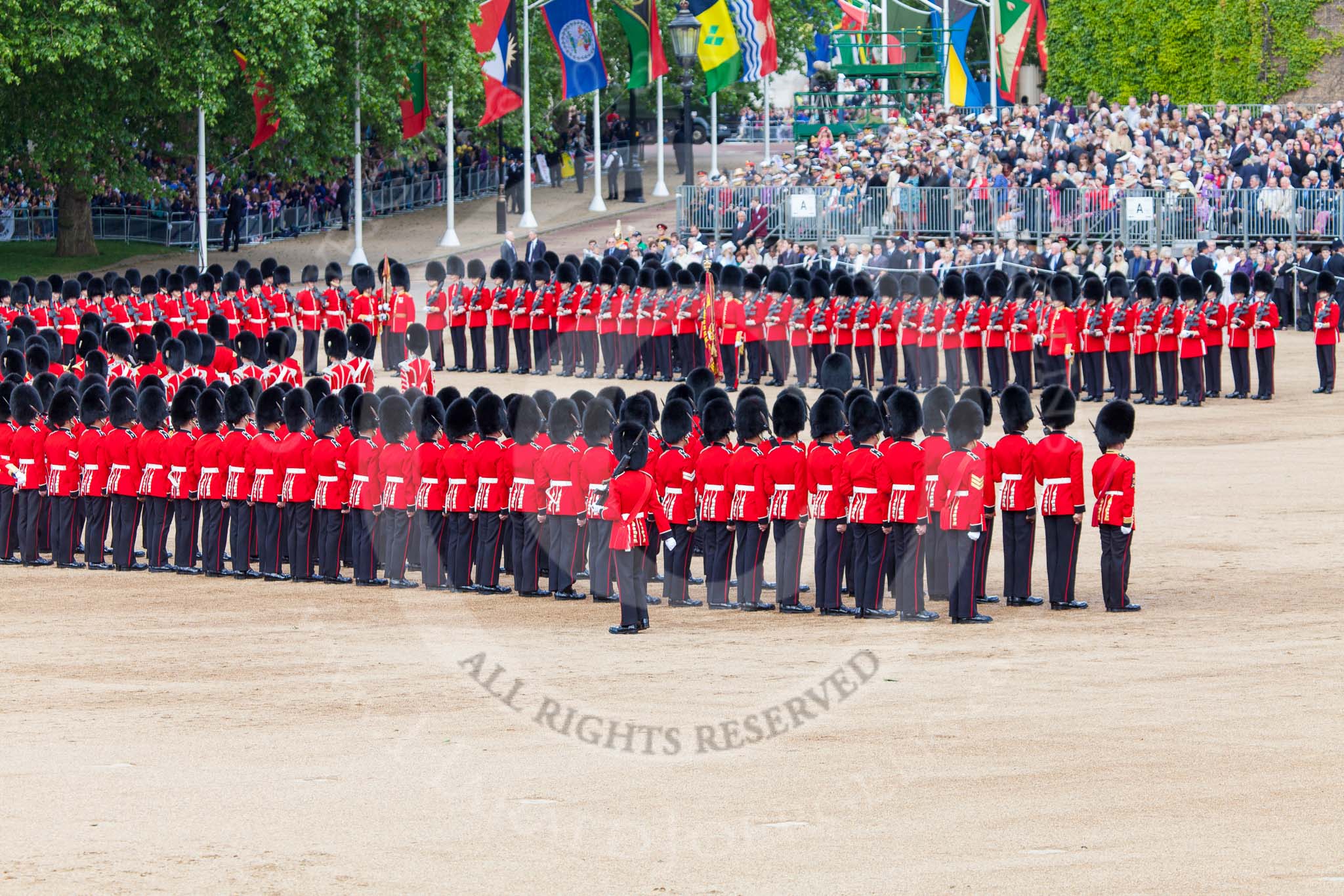 Trooping the Colour 2013: The Colour Party joins the Escort to the Colour, here Colour Sergeant, R J Heath, Welsh Guards, at the rear of the two lines of guardsmen. Image #473, 15 June 2013 11:22 Horse Guards Parade, London, UK