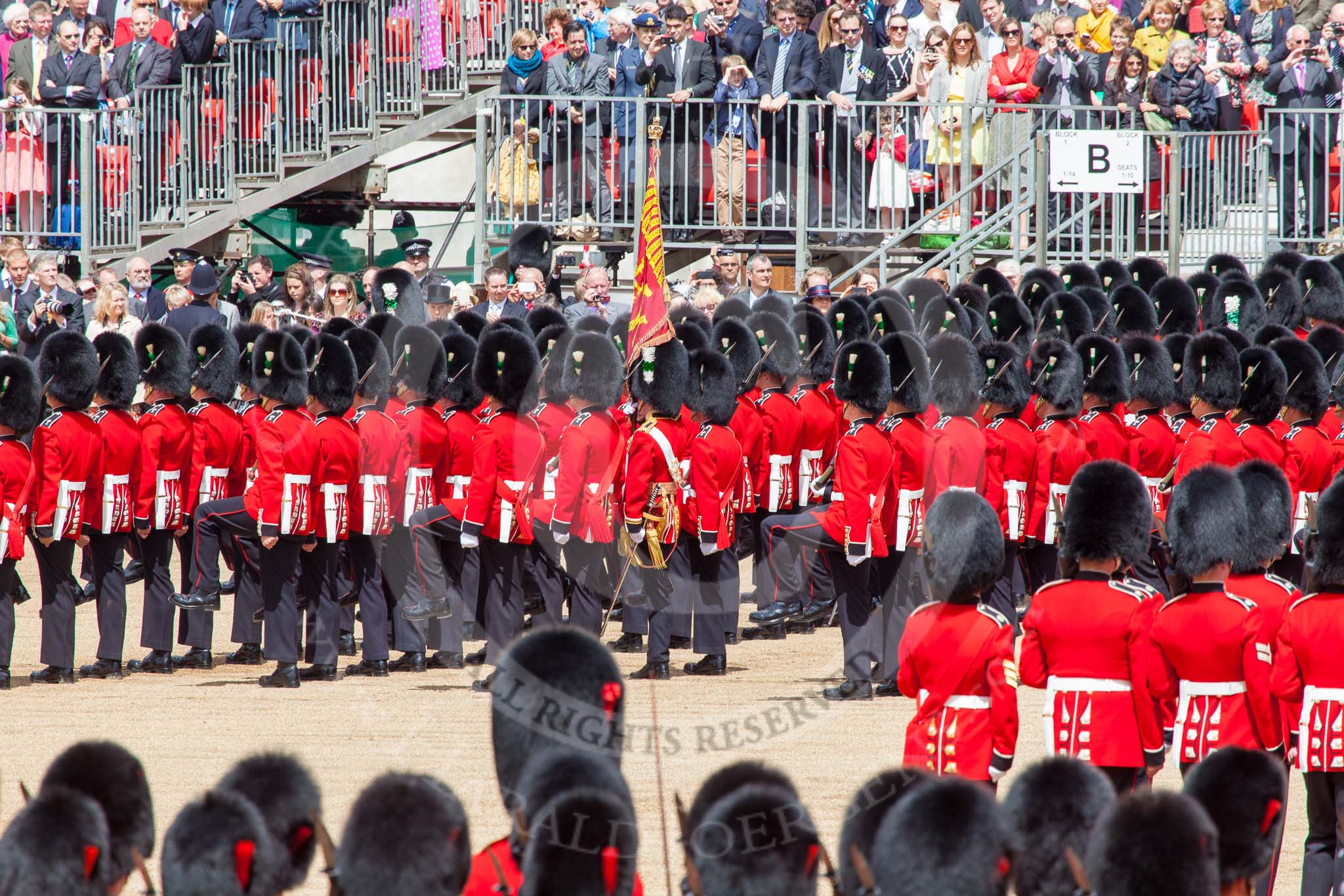 Trooping the Colour 2013: No. 1 Guard, the Escort to the Colour),1st Battalion Welsh Guards, with the Ensign carrting the Colour behind the lines of guardsmen, during the March Past. Image #558, 15 June 2013 11:39 Horse Guards Parade, London, UK