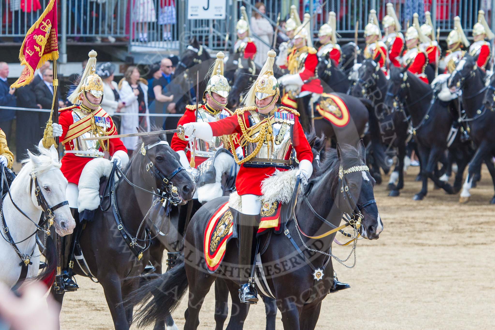 Trooping the Colour 2013: The Ride Past - The Sovereign's Escort, Household Cavalry, here the Field Officer of the Escort, Major Nick Stewart, The Life Guards, followed by the Trumpeter (Lance Corporal Ben Ruffer, The Life Guards), the Standard Bearer (Squadron Corporal Major Kris Newell, The Life Guards) and the Standard Coverer (Staff Corporal Steve Chinn, The Life Guards). Image #726, 15 June 2013 11:59 Horse Guards Parade, London, UK