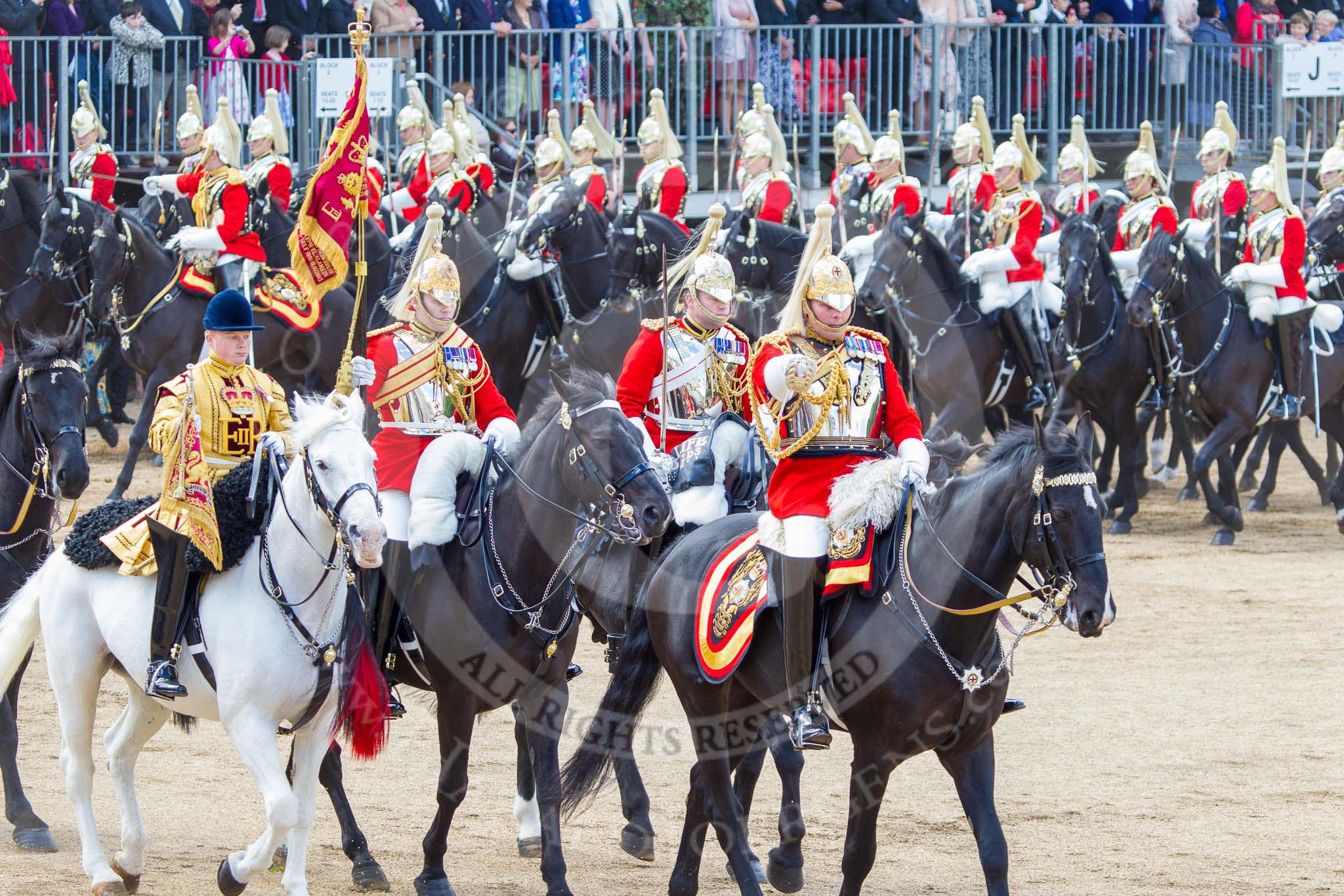 Trooping the Colour 2013: The Ride Past - The Sovereign's Escort, Household Cavalry, here the Field Officer of the Escort, Major Nick Stewart, The Life Guards, followed by the Trumpeter (Lance Corporal Ben Ruffer, The Life Guards), the Standard Bearer (Squadron Corporal Major Kris Newell, The Life Guards) and the Standard Coverer (Staff Corporal Steve Chinn, The Life Guards). Image #727, 15 June 2013 11:59 Horse Guards Parade, London, UK