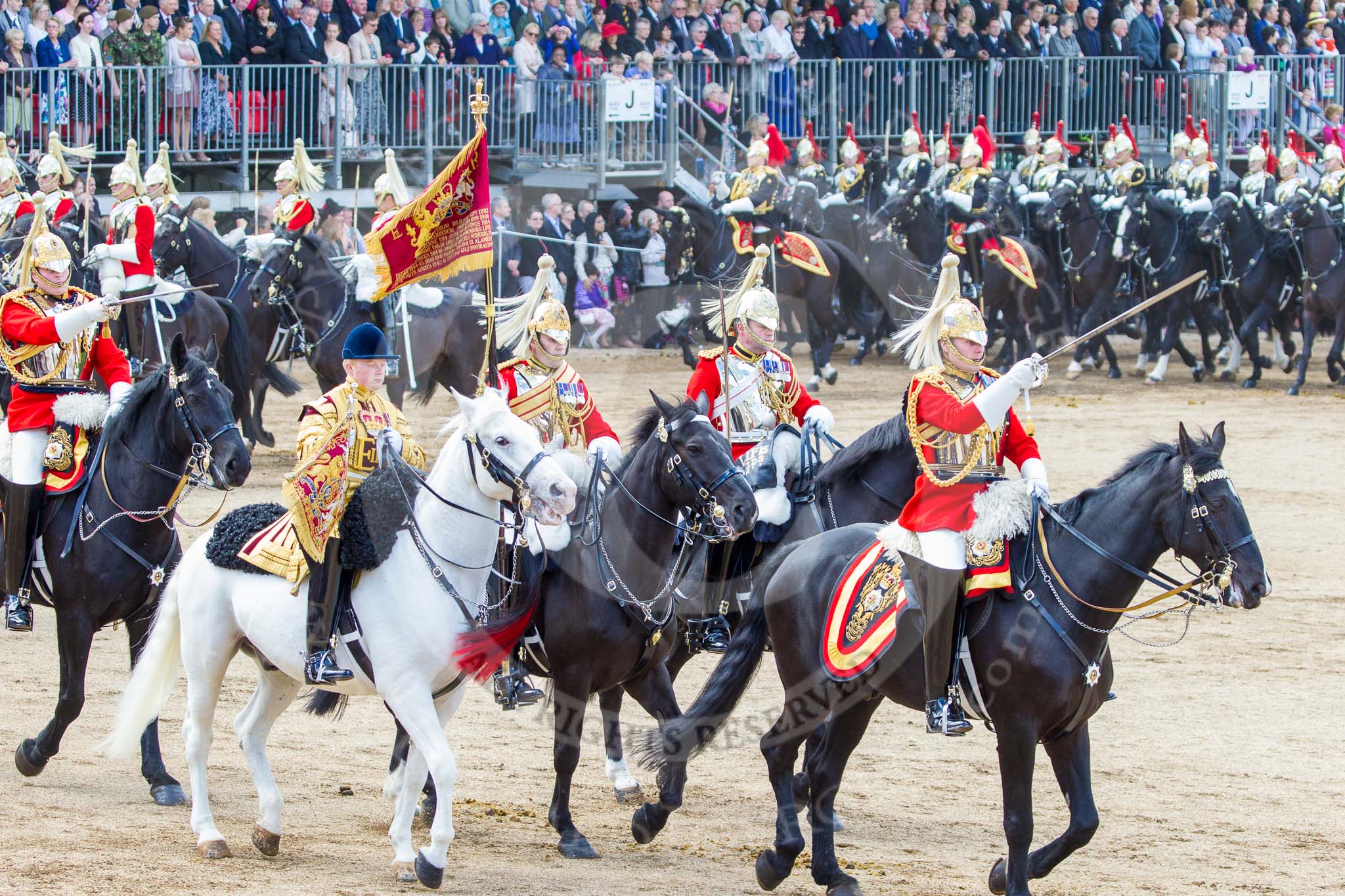 Trooping the Colour 2013: The Ride Past - The Sovereign's Escort, Household Cavalry, here the Field Officer of the Escort, Major Nick Stewart, The Life Guards, followed by the Trumpeter (Lance Corporal Ben Ruffer, The Life Guards), the Standard Bearer (Squadron Corporal Major Kris Newell, The Life Guards) and the Standard Coverer (Staff Corporal Steve Chinn, The Life Guards). Behind them is the Escort Commander Captain G R J Ashby, The Life Guards. Image #729, 15 June 2013 11:59 Horse Guards Parade, London, UK